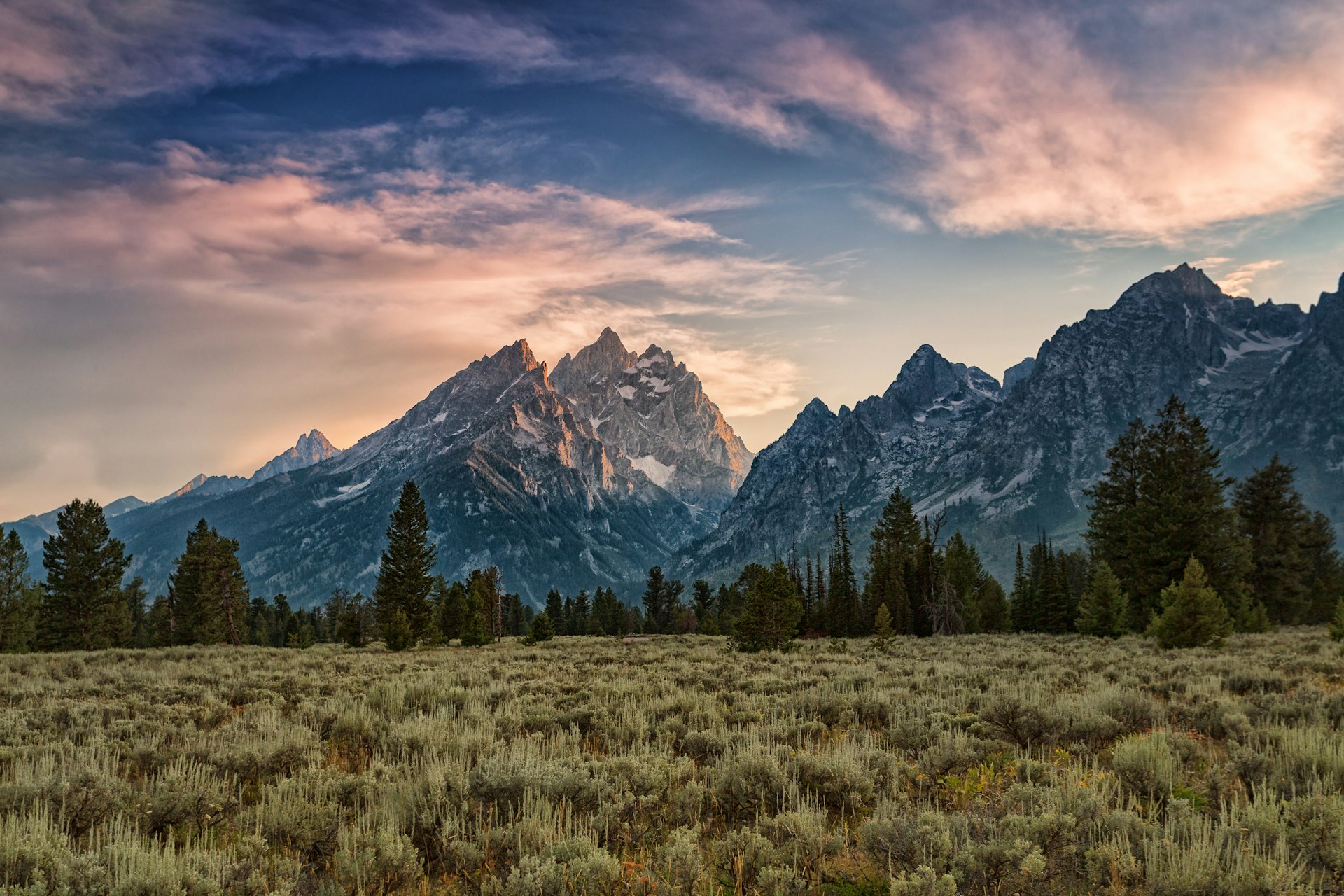 500px Photo ID: 116299579 - Sun mixed with clouds and smoke make for a colorful sunset in Grand Teton National Park