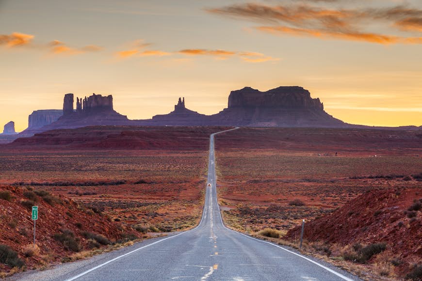 A road leading to the tall plateaus of Monument Valley