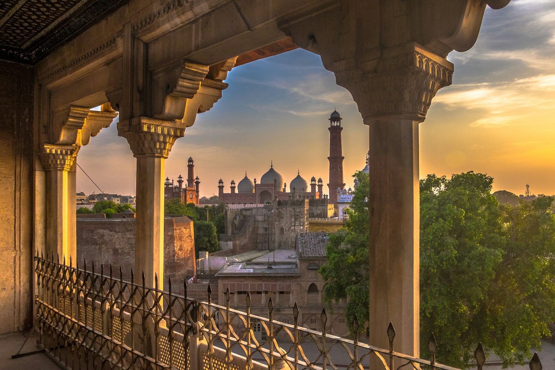 Lahore Grand Mosque from the balcony of Lahore Fort at sunset in Pakistan.