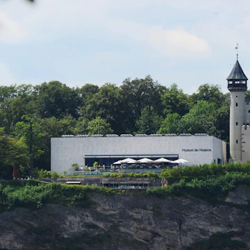SALZBURG, AUSTRIA - JULY 29: Salzburg Museum of Modern Art (L) and the historical water tower are pictured on July 29, 2011 in Salzburg, Austria. The Salzburg Festival is a prominent festival of music and drama established in 1920 and is held each summer within the Austrian town of Salzburg, the birthplace of Wolfgang Amadeus Mozart. (Photo by Martin Schalk/Getty Images)