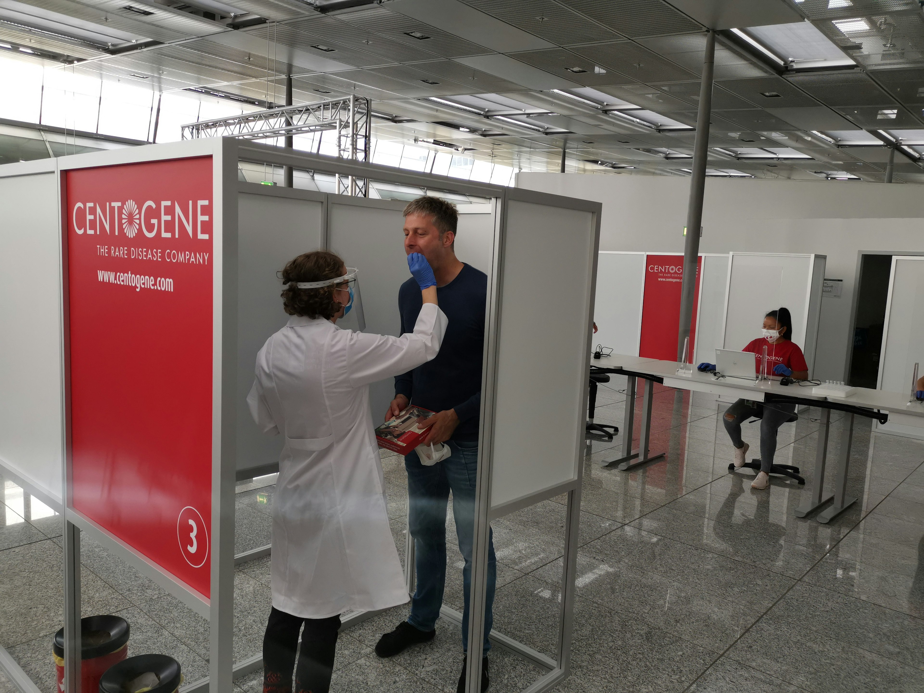 A passenger gets tested for COVID-19 at Frankfurt airport