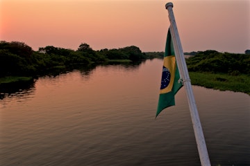 In this photo is possible to see a boat in the Anavilhanas Archipelago region.The river is the principal path of transportation for people and produce in the Amazon regions, with transport ranging from balsa rafts and dugout canoes to hand built wooden river craft and modern steel hulled craft.
