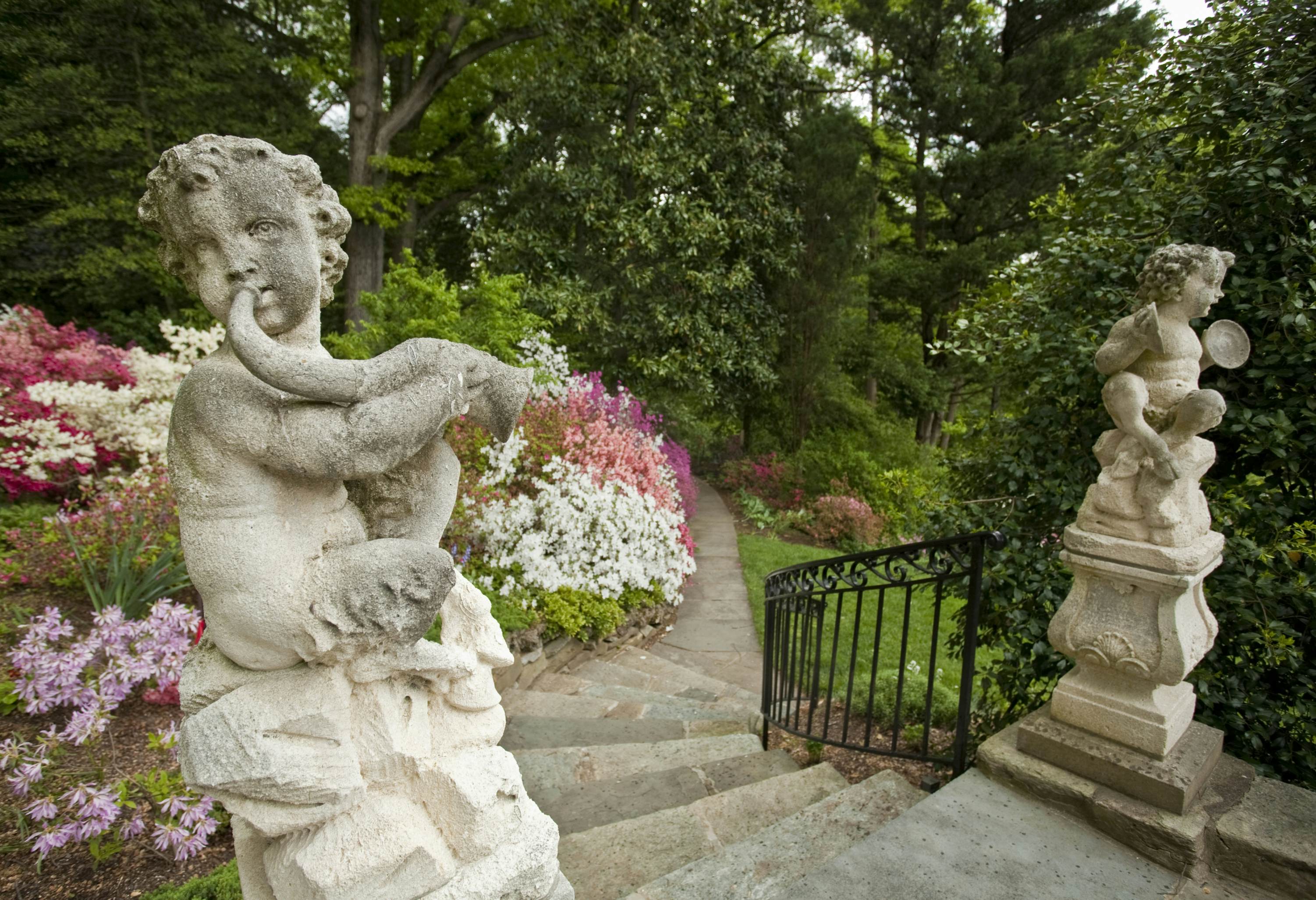 Satyr statute welcomes visitor to Hillwood Gardens, Washington, DC.