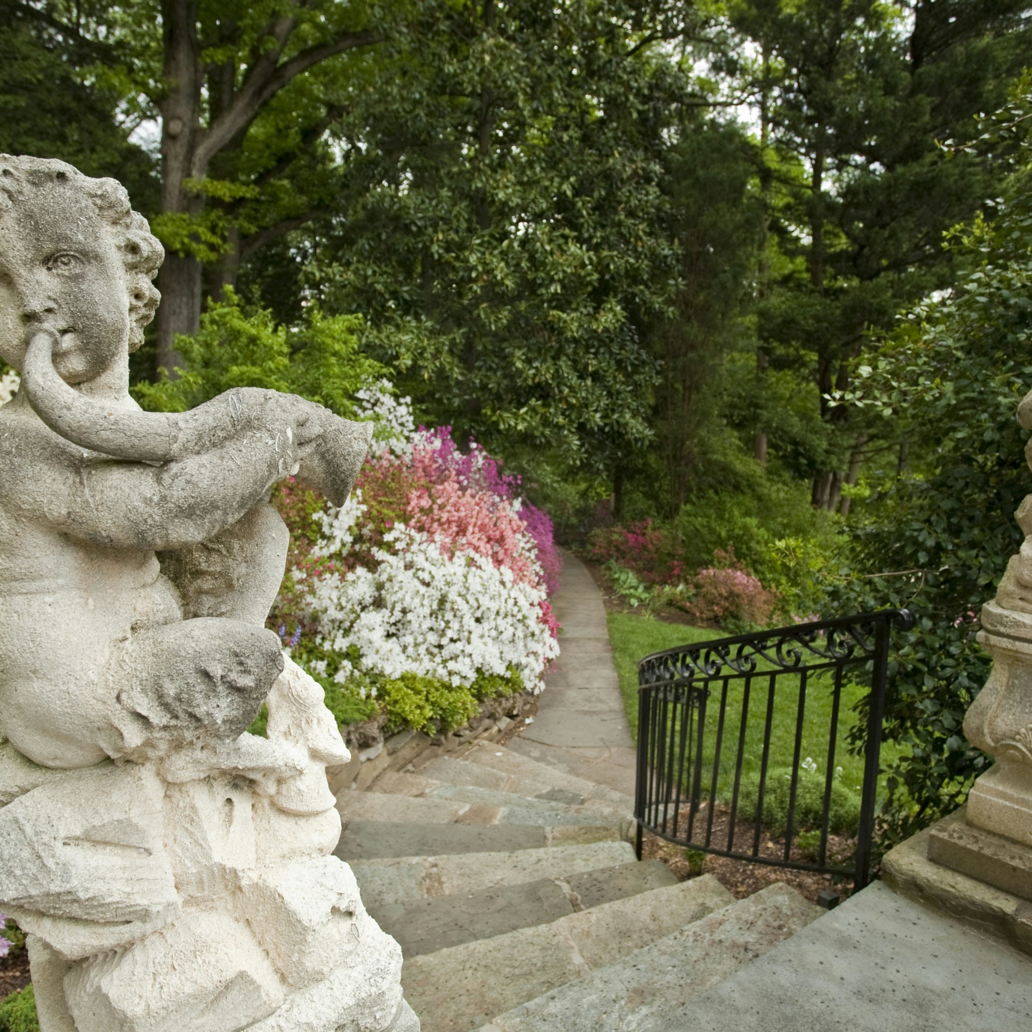 Satyr statute welcomes visitor to Hillwood Gardens, Washington, DC.