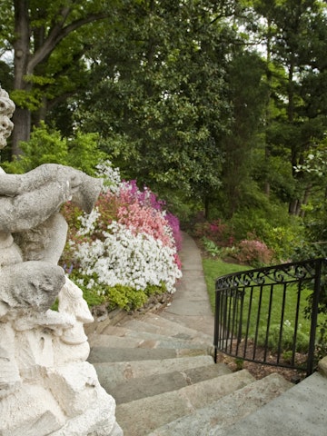 Satyr statute welcomes visitor to Hillwood Gardens, Washington, DC.