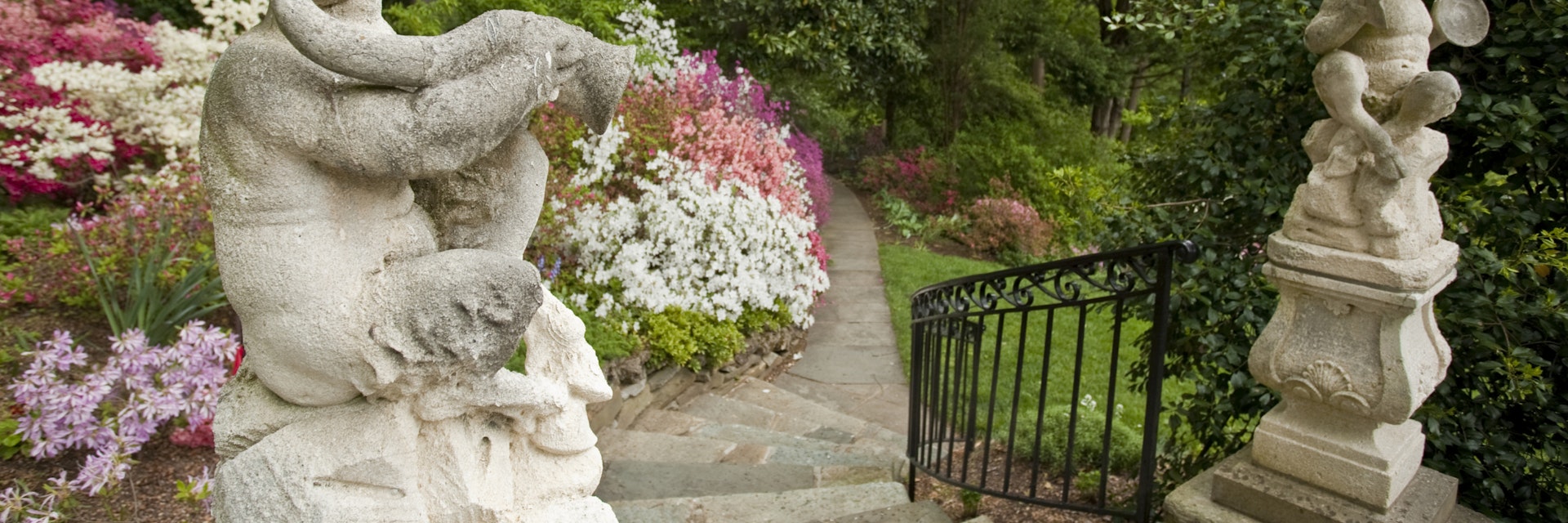 Satyr statute welcomes visitor to Hillwood Gardens, Washington, DC.