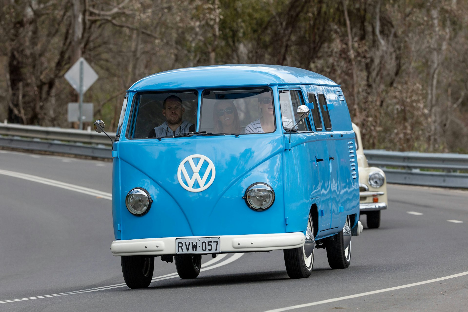 Vintage 1959 Volkswagen Kombi Van driving on country roads near the town of Birdwood, South Australia.
