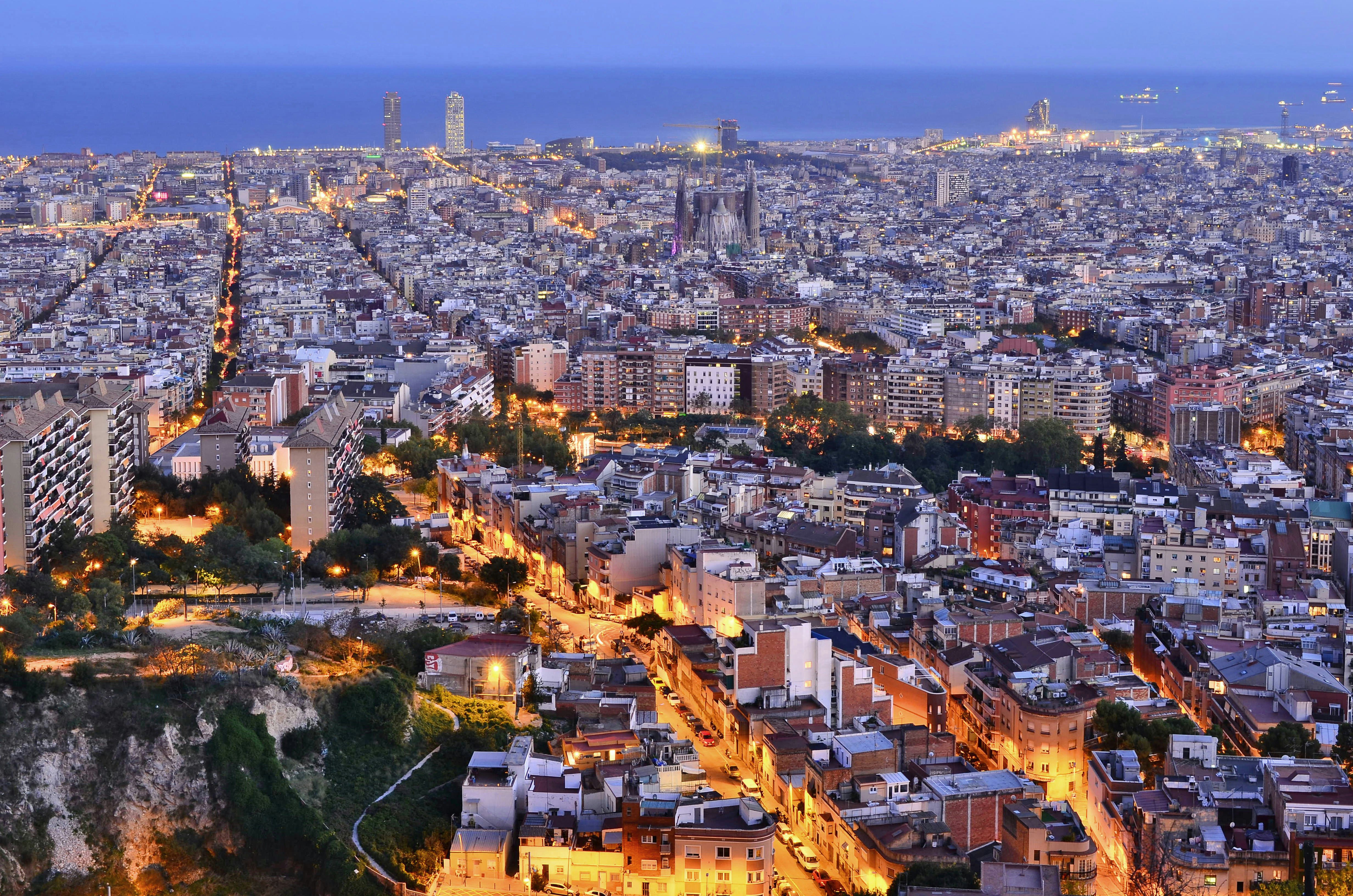 Overview of Barcelona illuminated at dusk