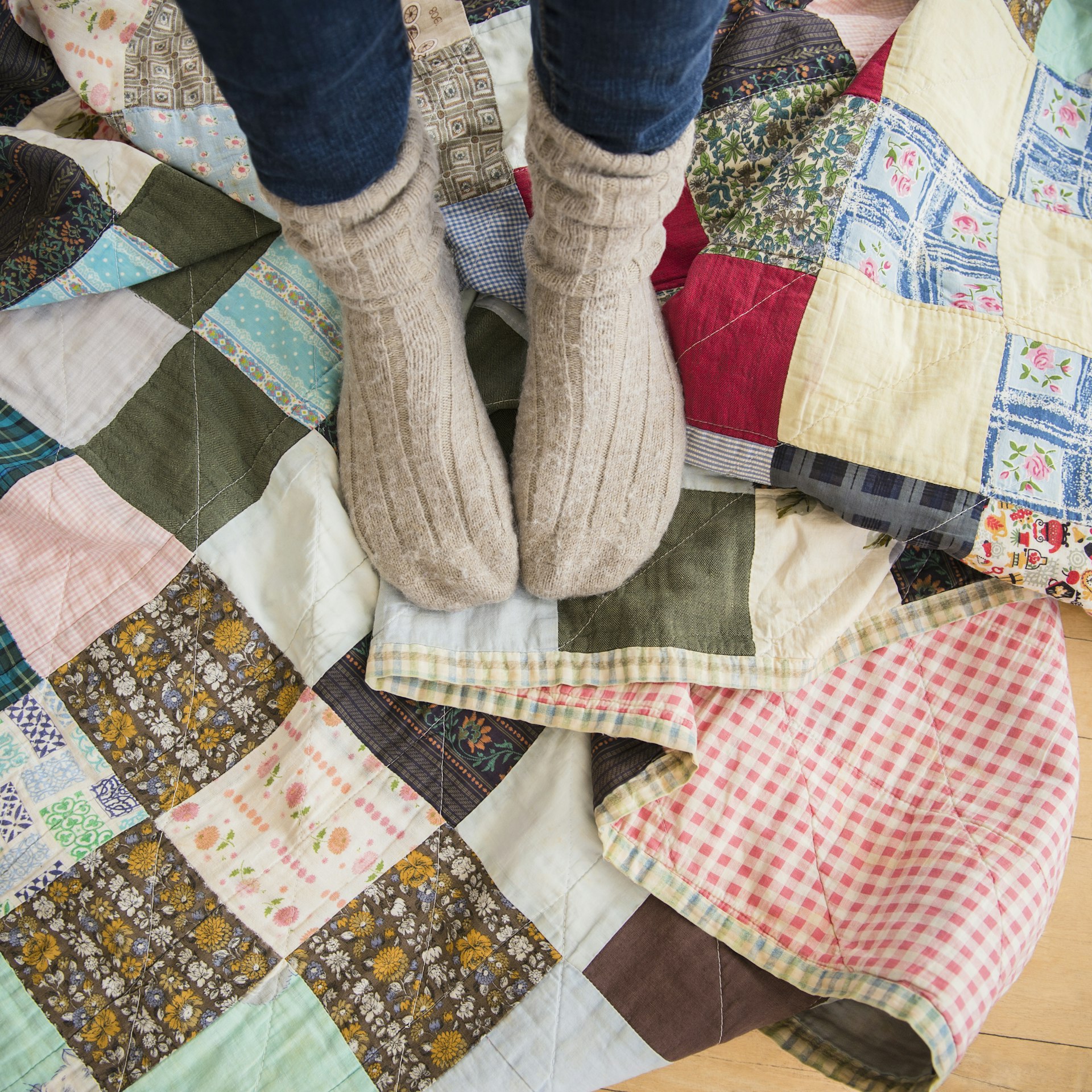 Elevated view of woman's legs wearing woolen socks