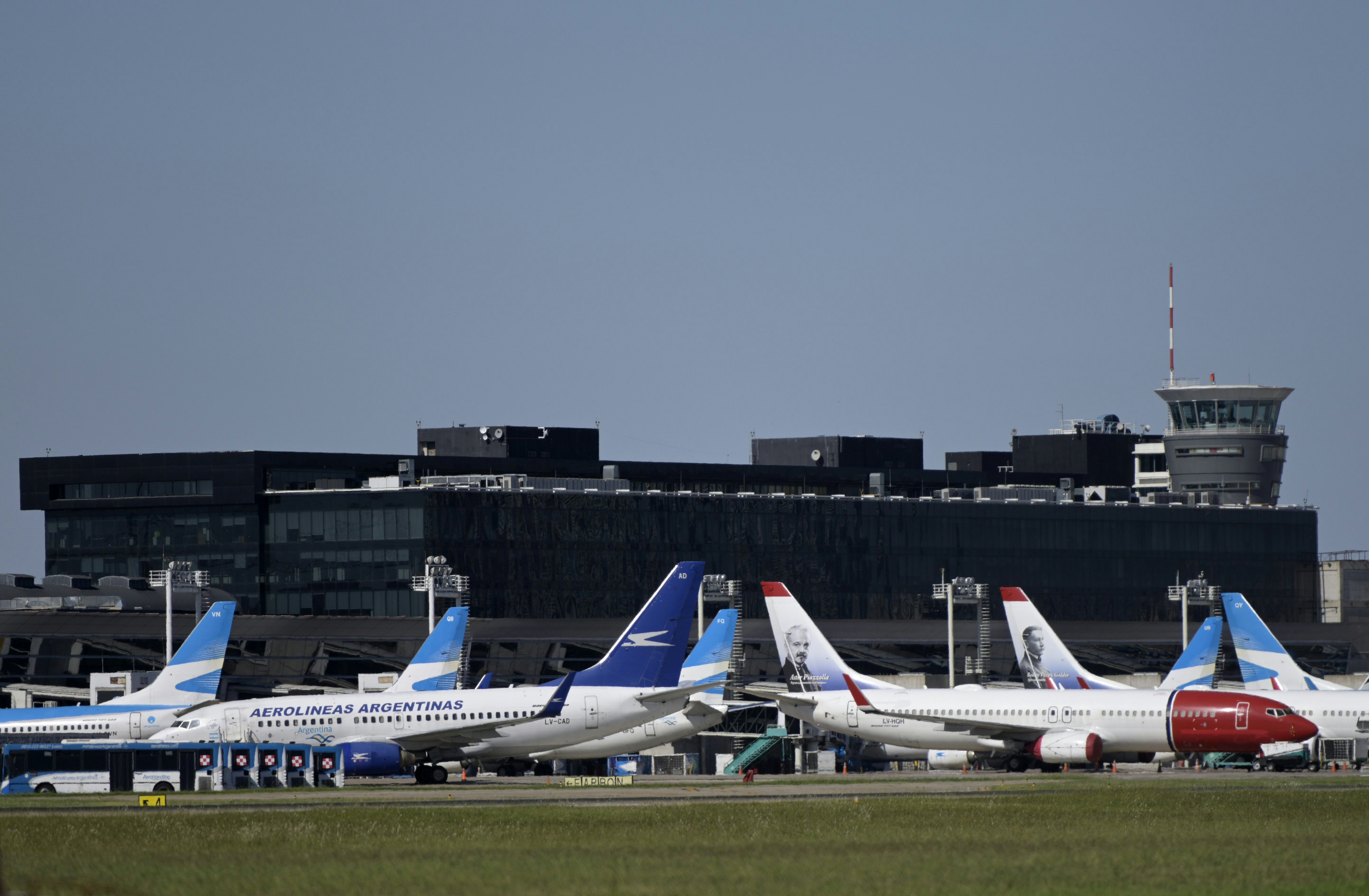 Commercial aircrafts remain at the tarmac of Jorge Newbery airport which is closed during the outbreak of COVID-1