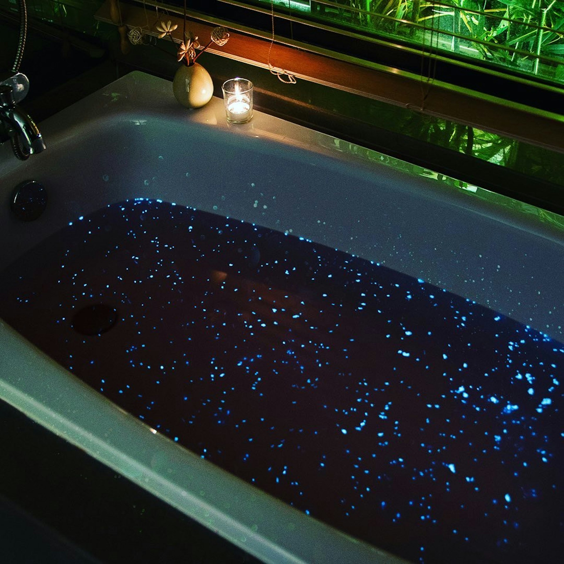 Bath Diamond's luminescent bath bomb in a tub