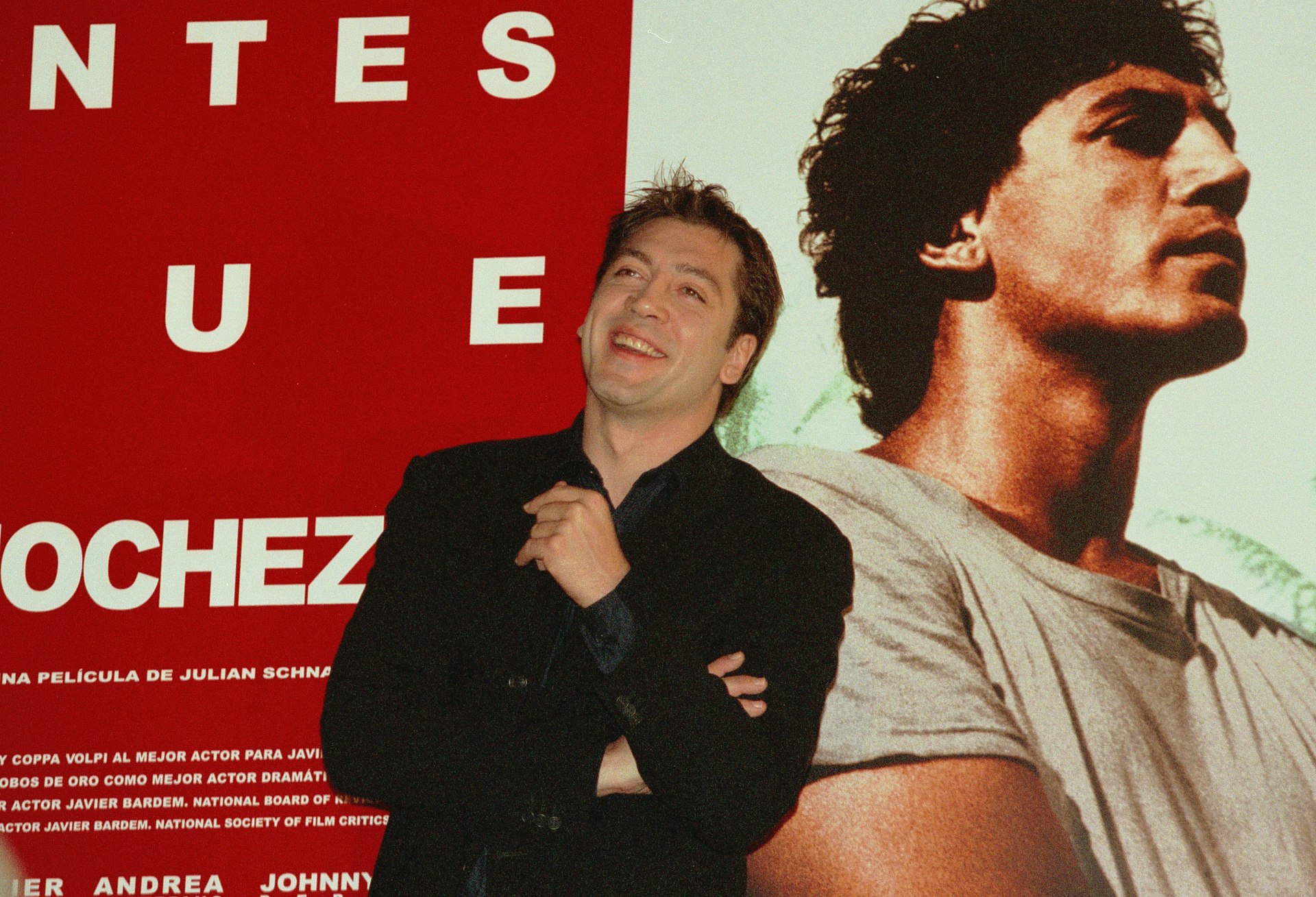 Actor Javier Bardem stands in front of a promotional poster of himself  from the film "Before Night Falls" in Madrid, Spain.