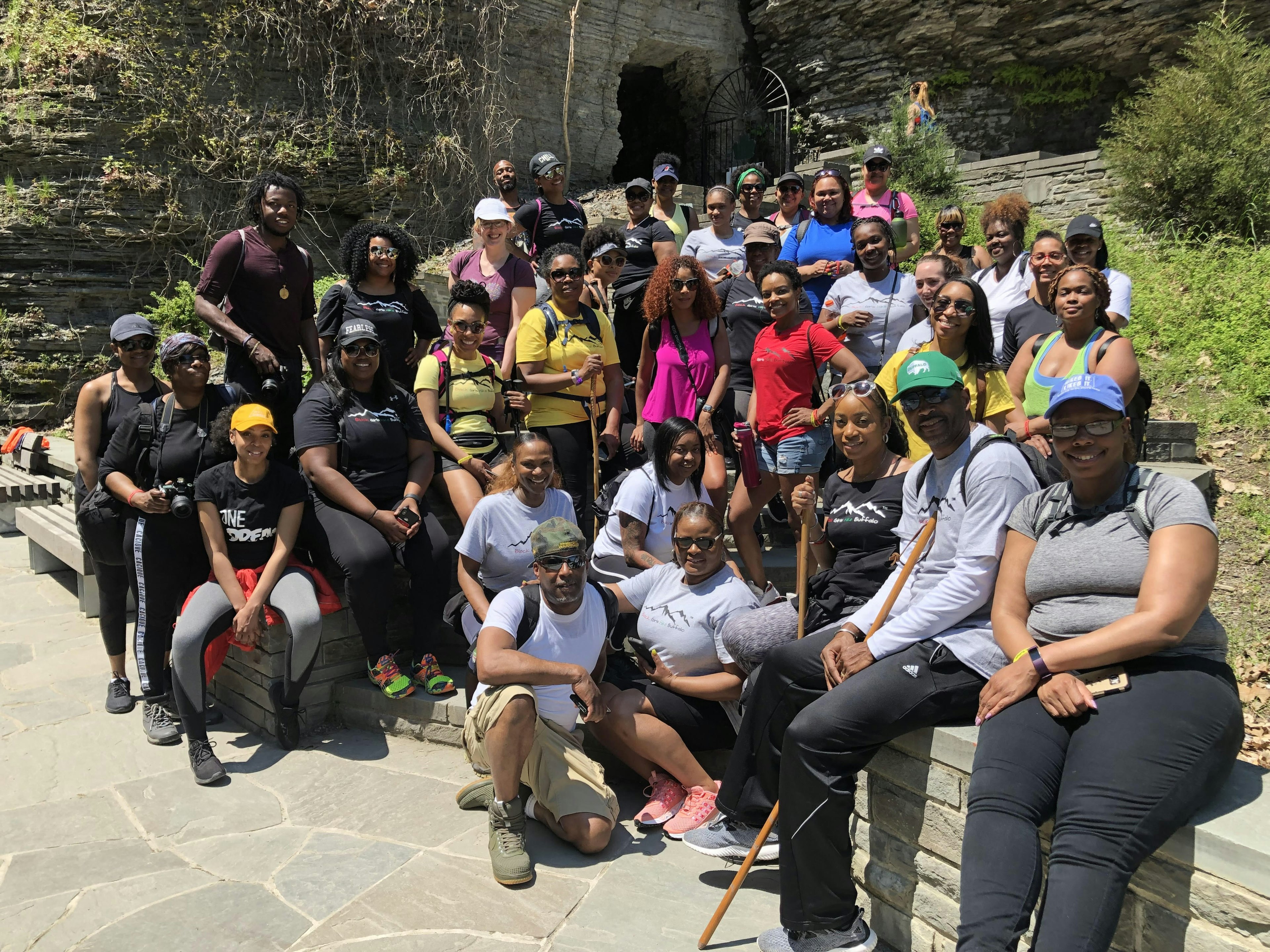 A group of Black hikers pose for a camera as part of Black Girls Hike Buffalo