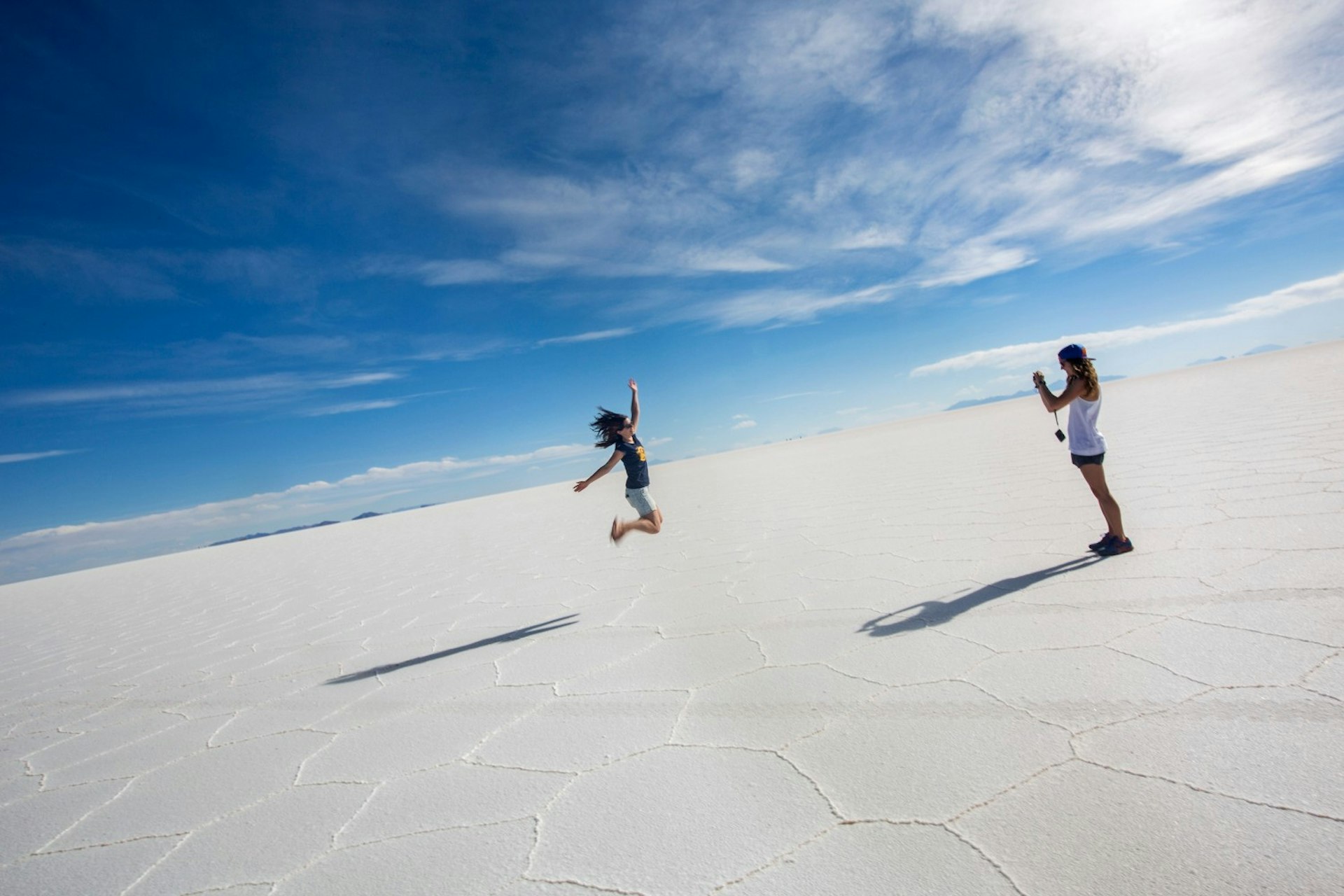 Two women jumping on the Bolivia Salt Flats