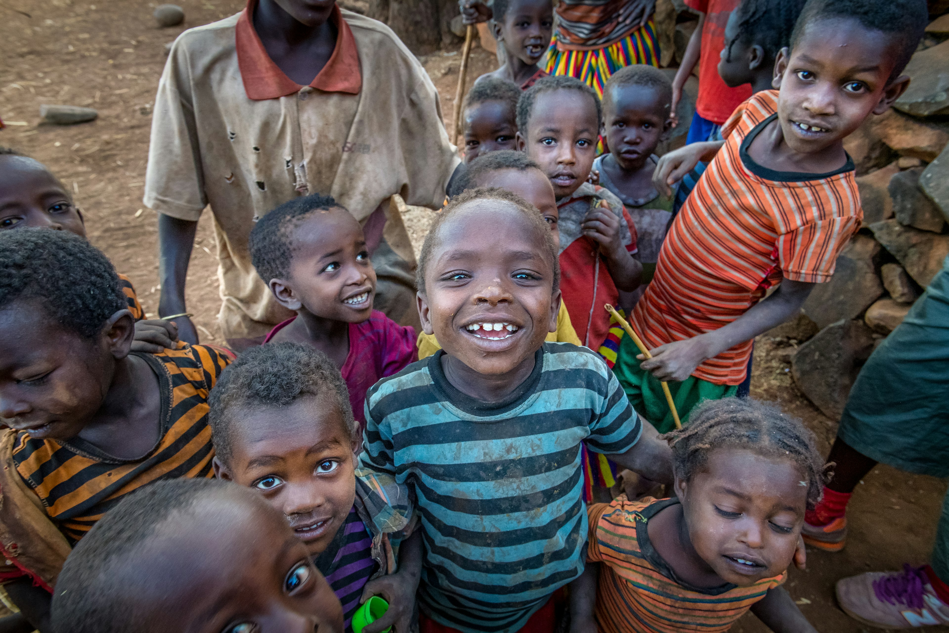 A group of Ethiopian children smile up at the camera