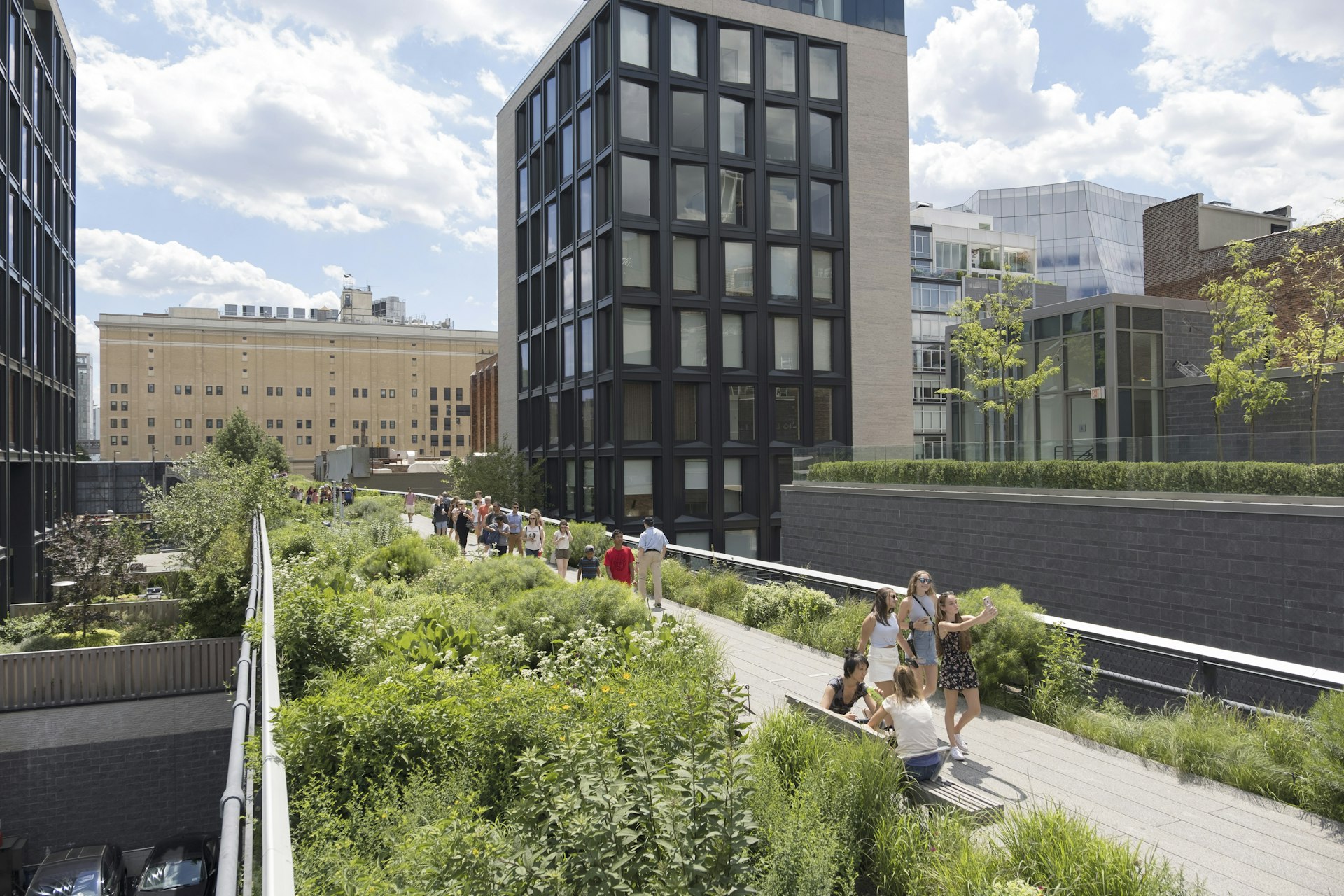 People explore Chelsea’s High Line park, built 2.3km of abandoned elevated rail track on Manhattan’s far west side. 