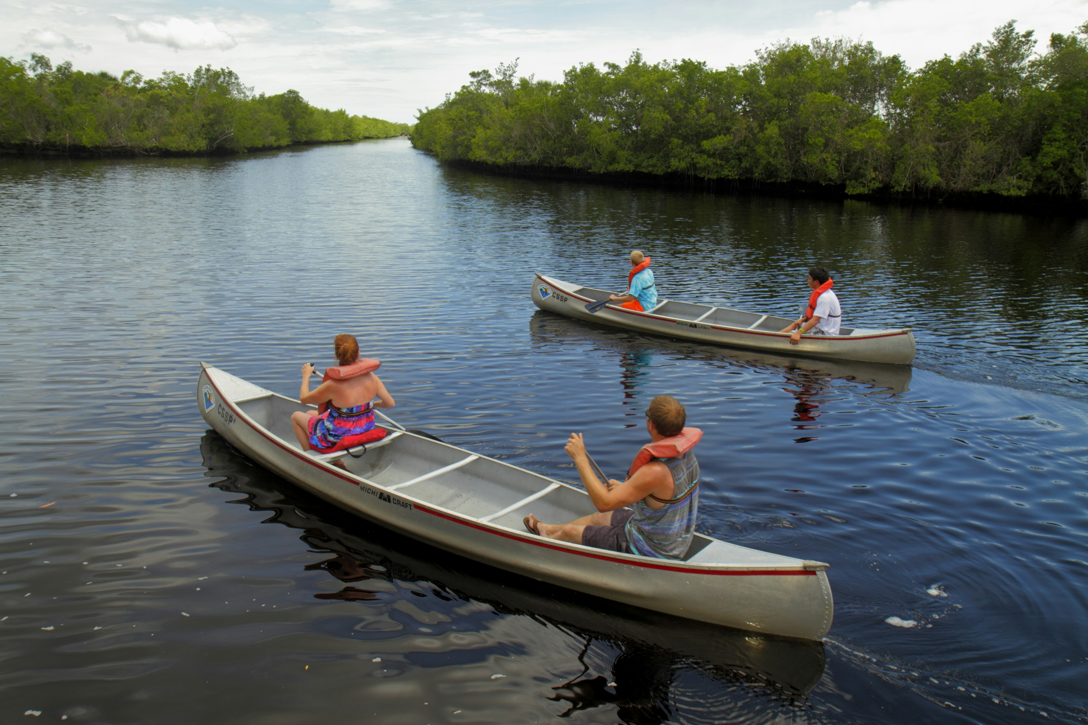 A family in rental canoes on Blackwater River