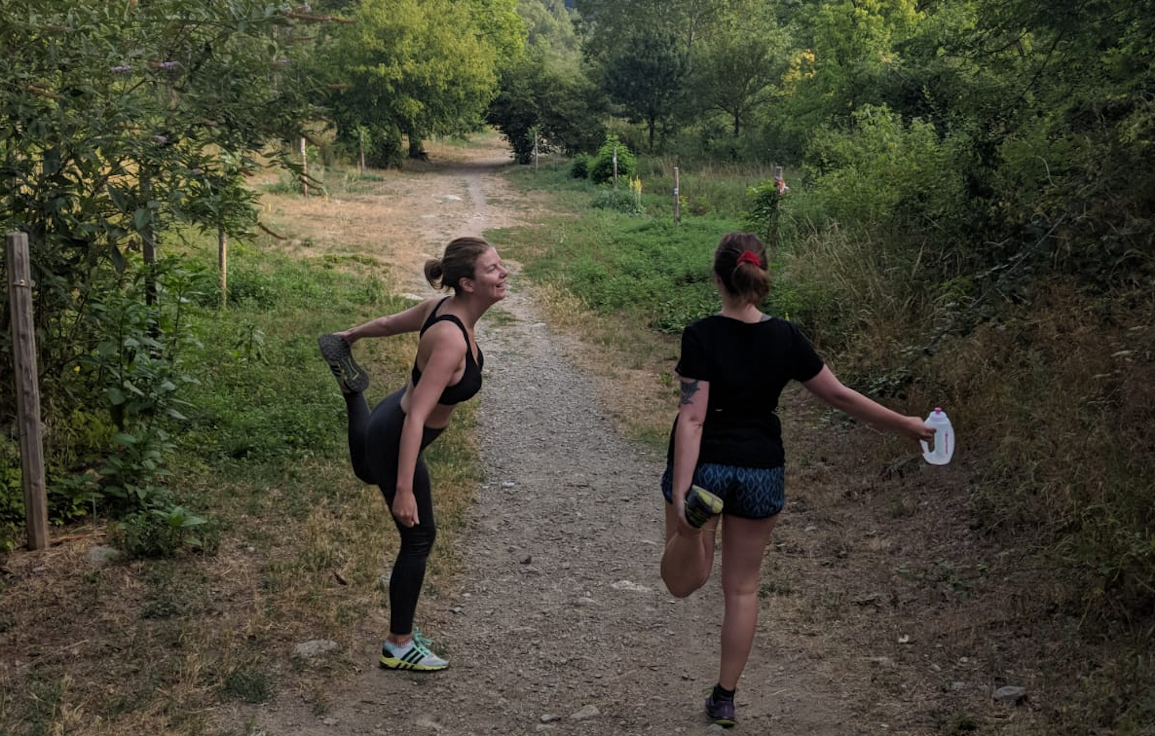 Two young women in a forest in leisure gear.png