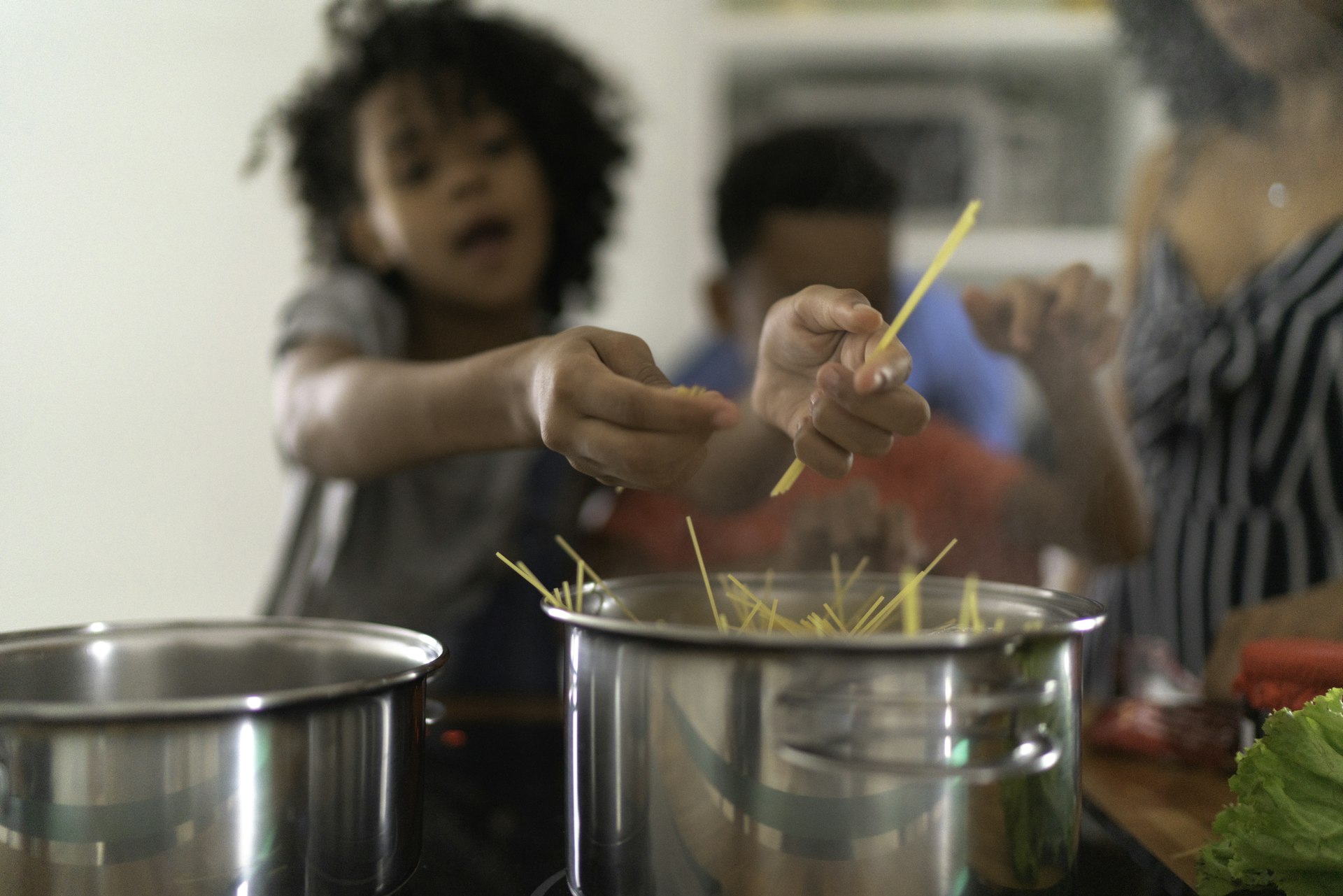 Family Cooking Together at Kitchen