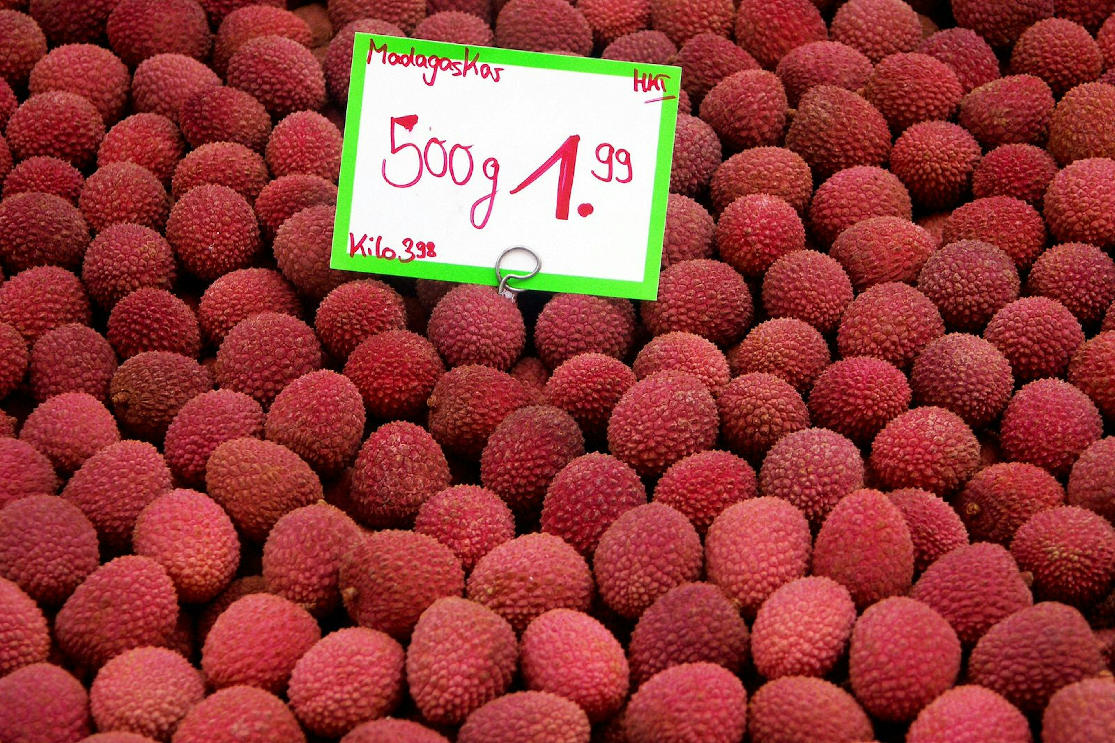 A fruit stand filled with ruby red Lychees in Madagascar