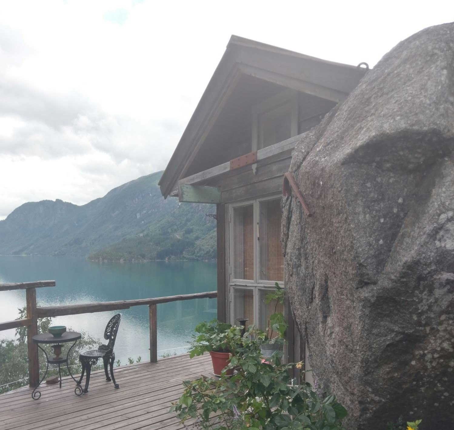 The balcony of a cottage in Norway overlooking the sea