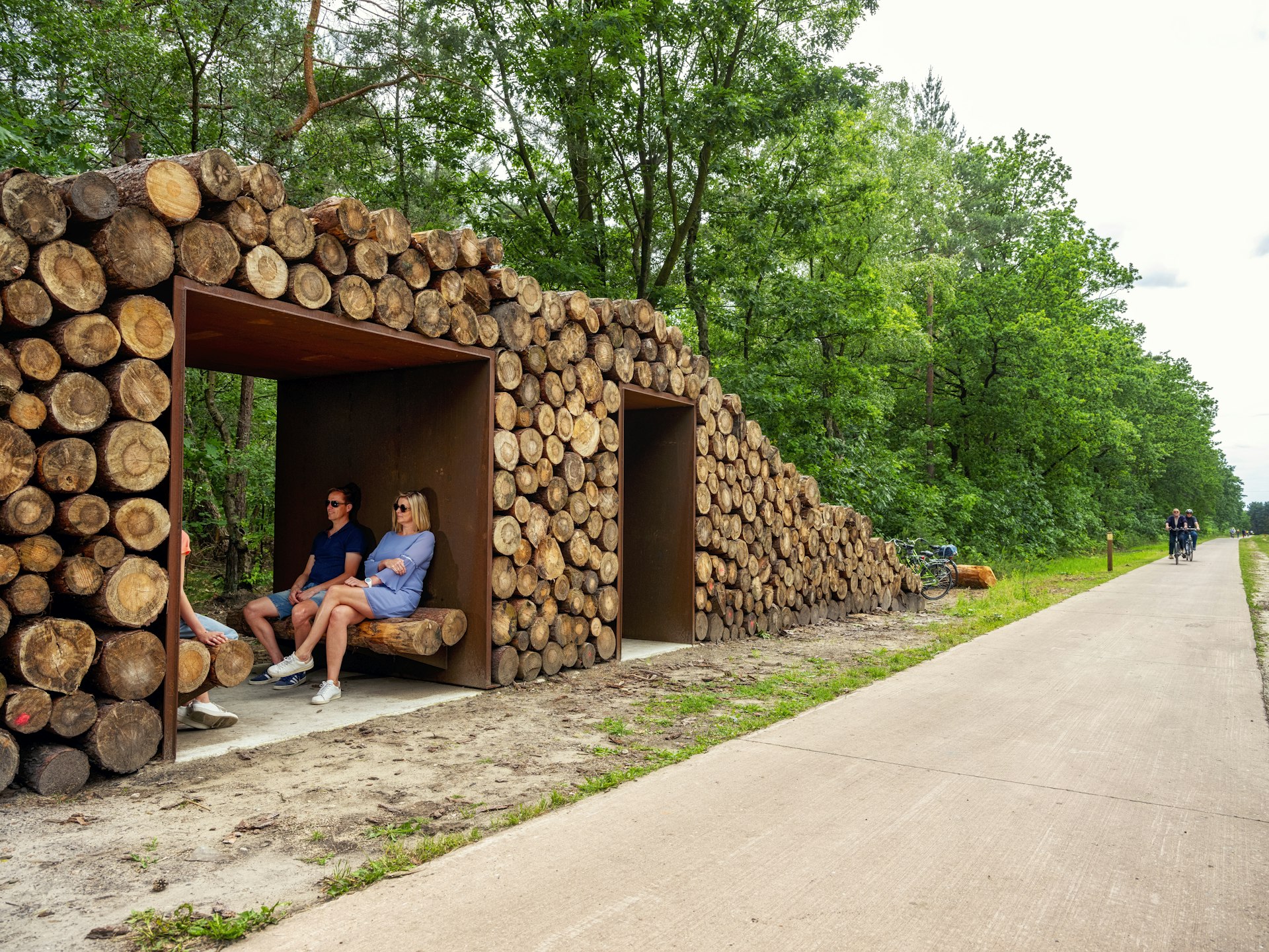 A resting spot on a cycle trail made from recycled tree trunks
