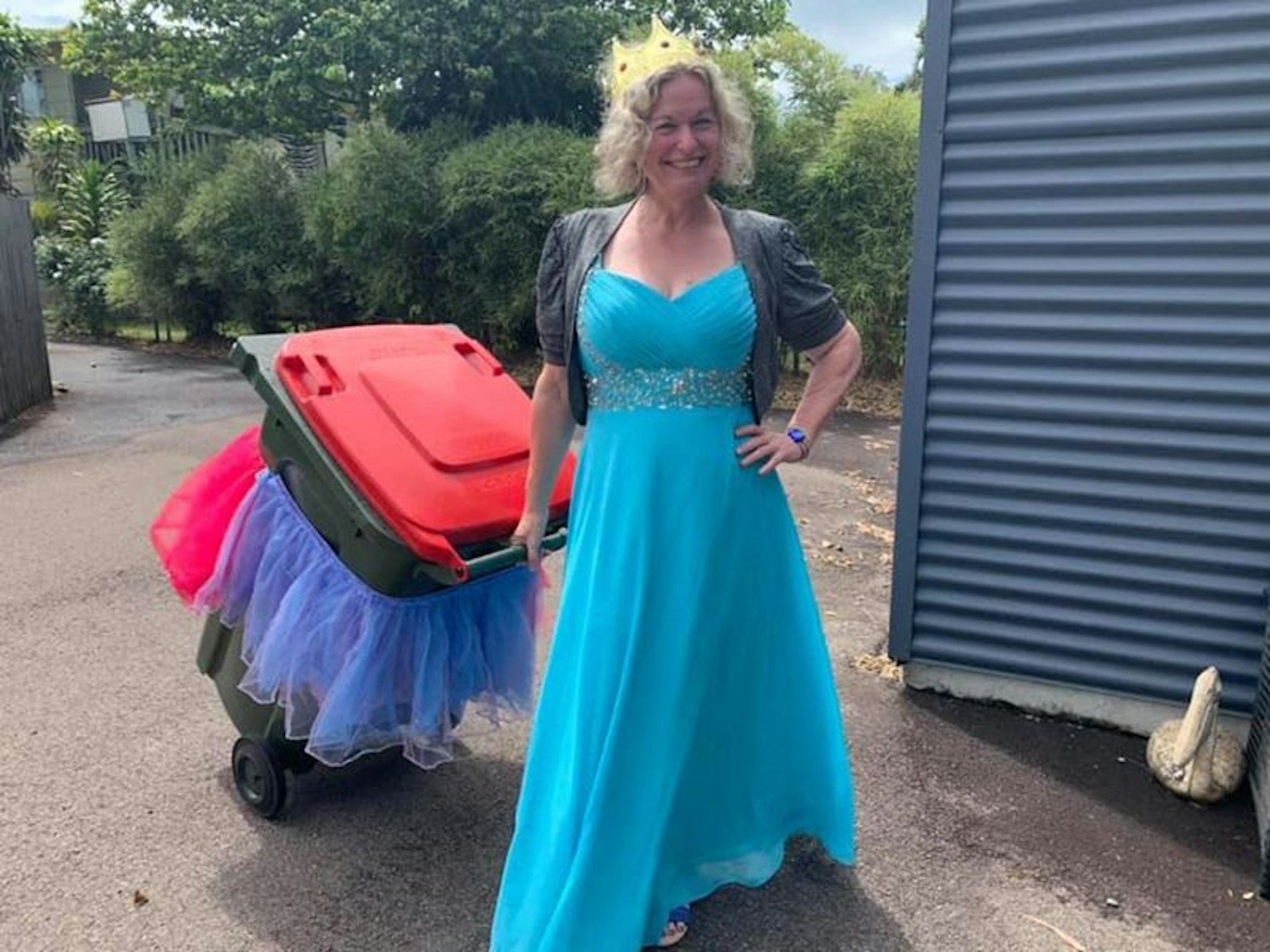 A woman in a ball dress with her decorated bin