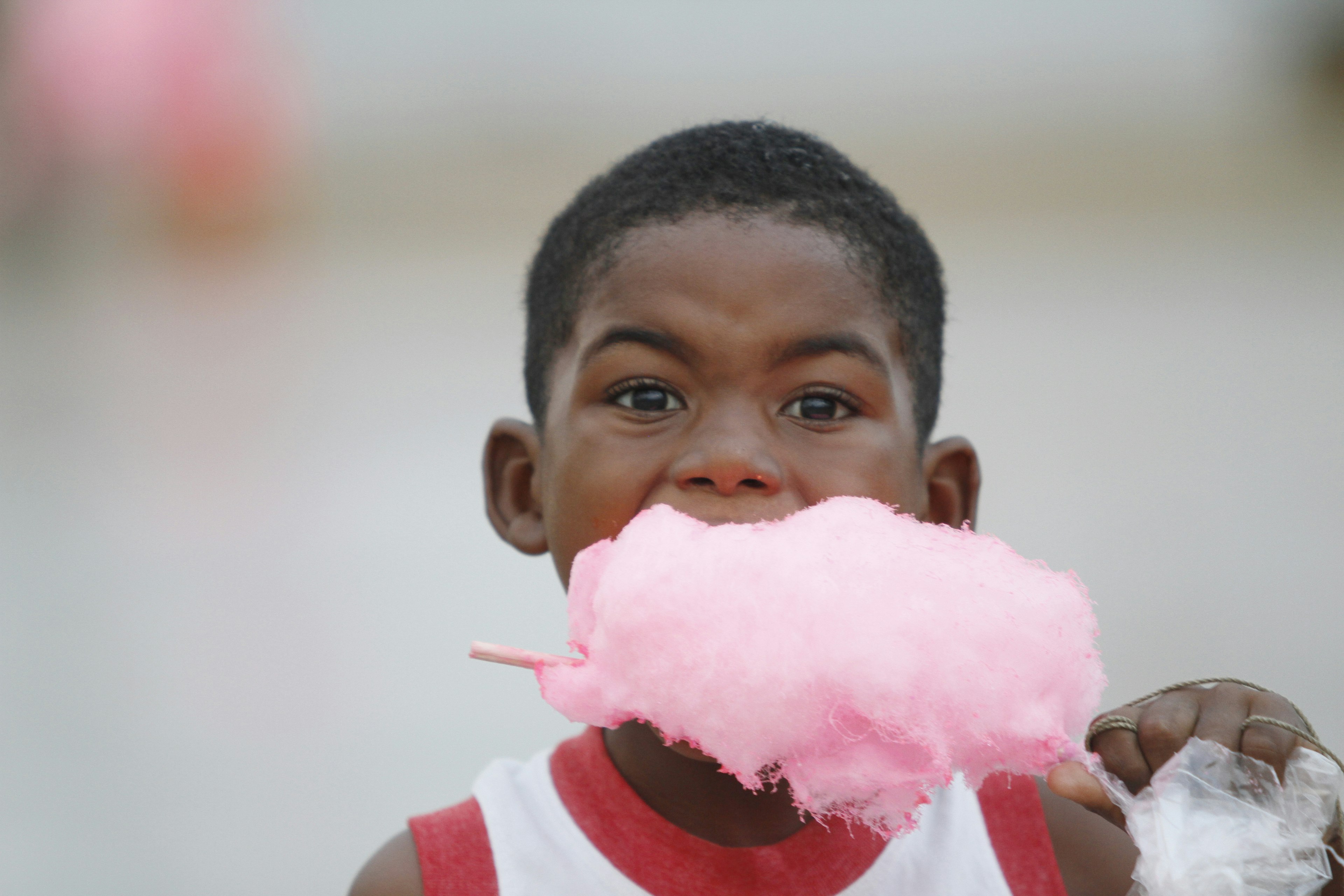 A child enjoys cotton candy in Esmeraldas, Ecuador,