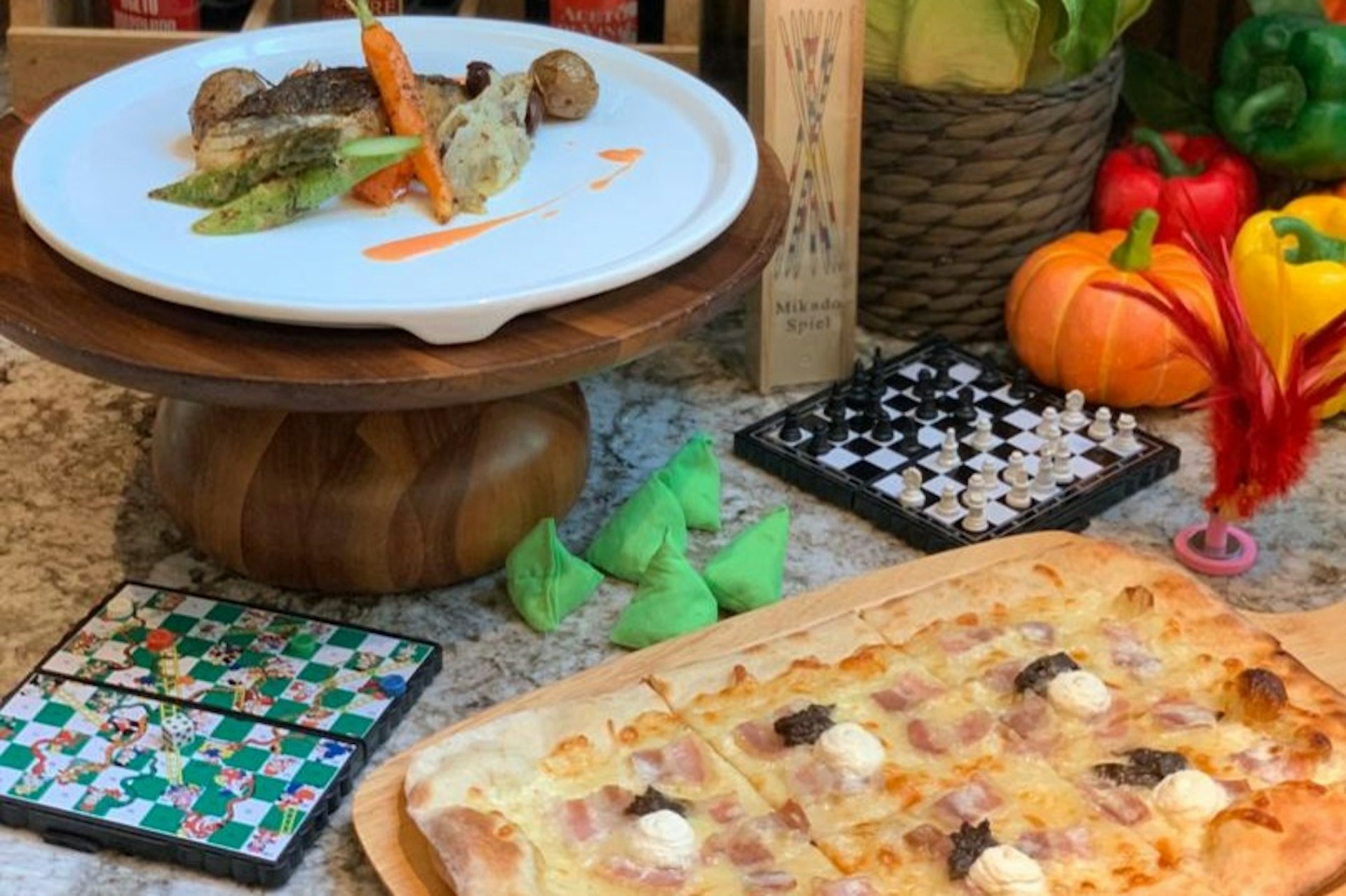 Board games beside plates of food
