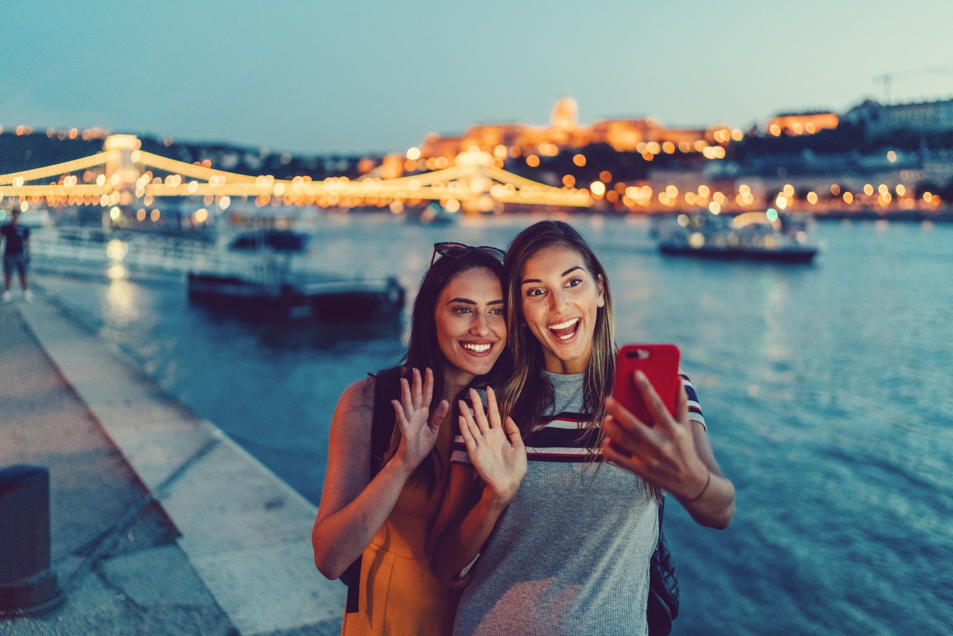 Women traveling in Europe and enjoying a video call