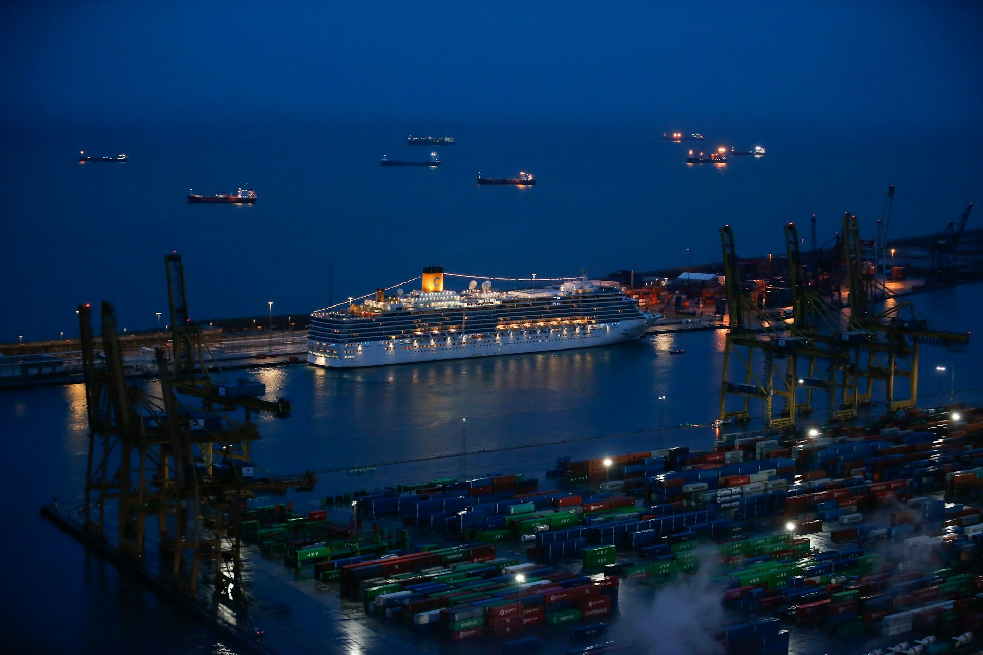 The Costa Deliziosa is docked at the port of Barcelona early on April 20, 2020 to disembark passengers amid a national lockdown to fight the spread of the coronavirus