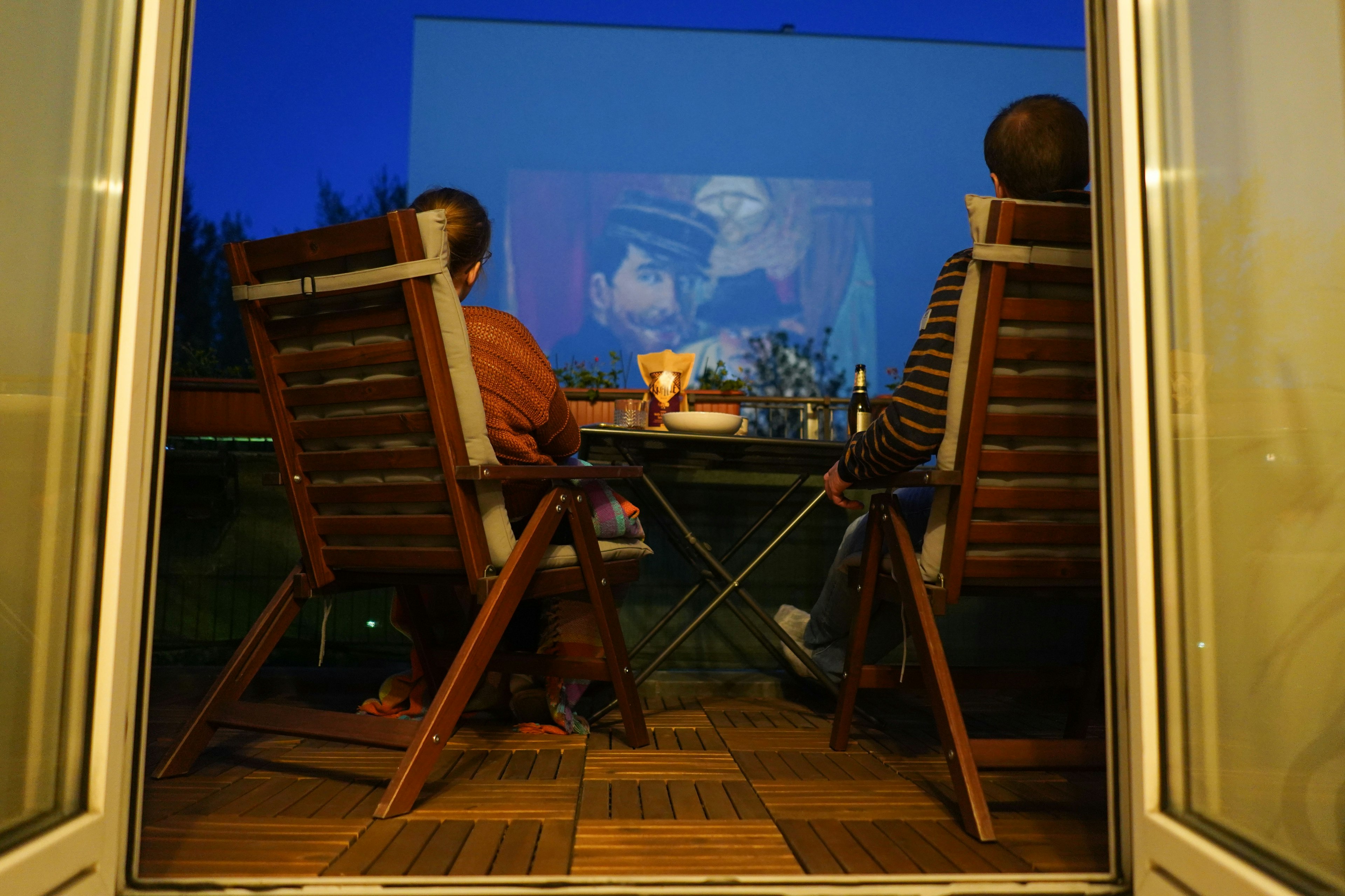 Residents of an apartment in Wilhelmstraße watch a film