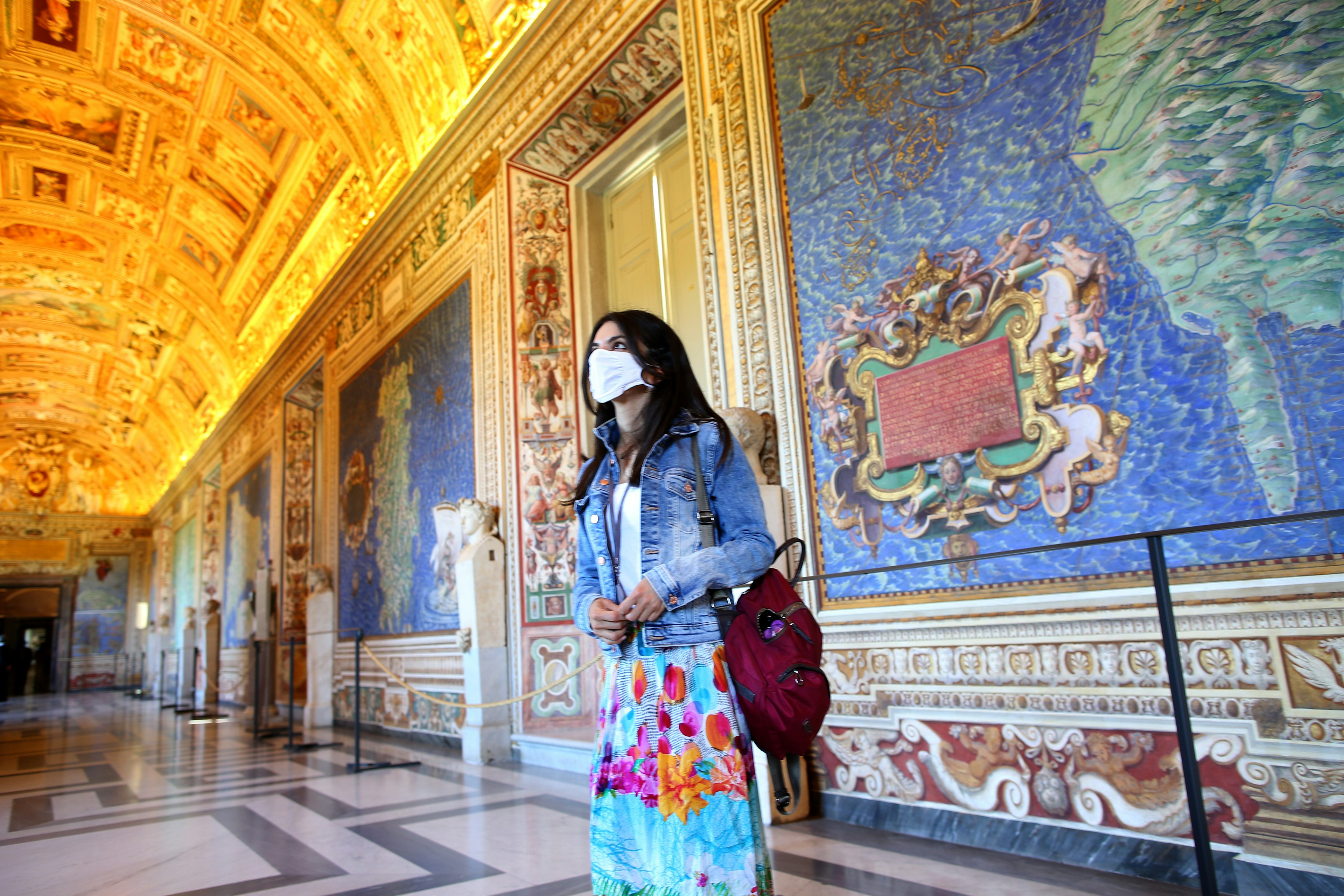 Visitors walk in the 'Gallery of the Maps' of Vatican Museum during the reopening after three months of shutdown