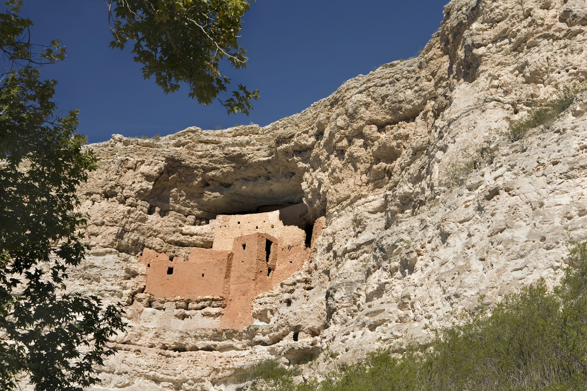 A prehistoric pueblo in the side of a cliff at Montezuma Castle in Arizona