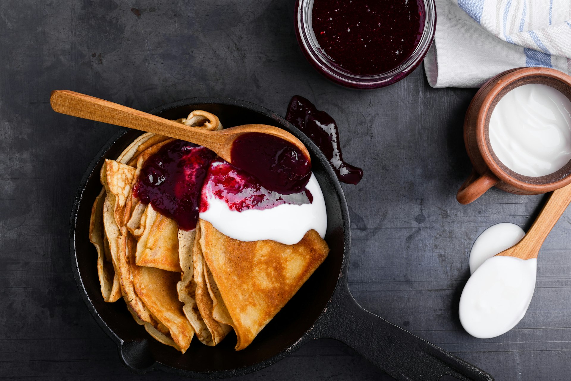 Stack of pancakes in cast iron dish.