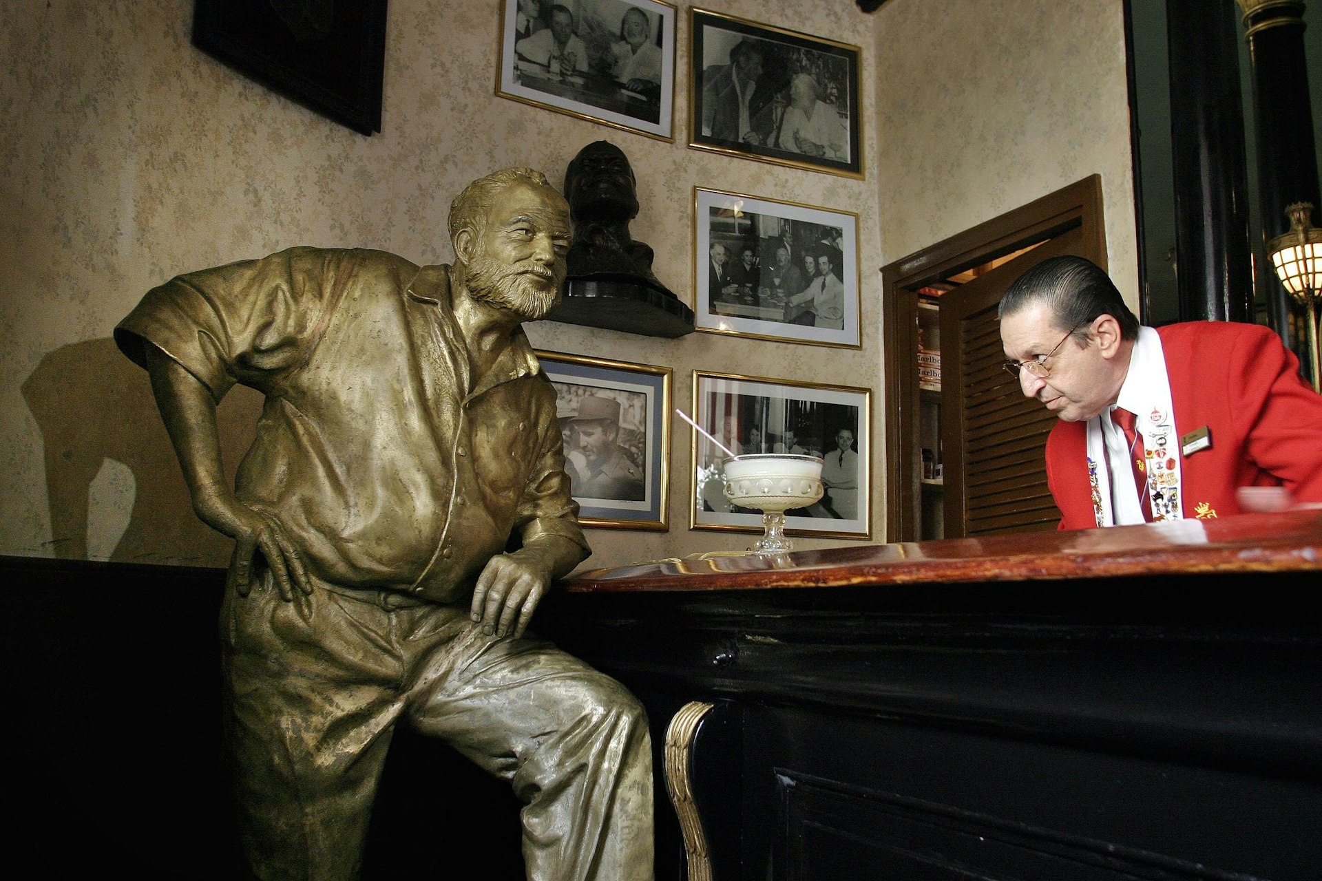 A life-size bronze statue of American writer Ernest "Papa" Hemingway, Literature Nobel Prize winner, leans on the bar at his regular spot at the Restaurant El Floridita bar, on October 27, 2003, in Havana, Cuba