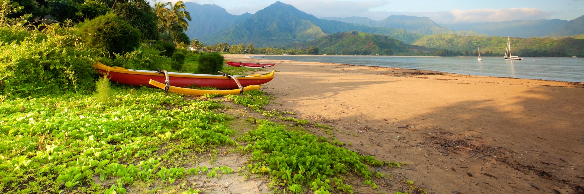 Outrigger canoe near the beach of Hanalei Bay just after sunrise.