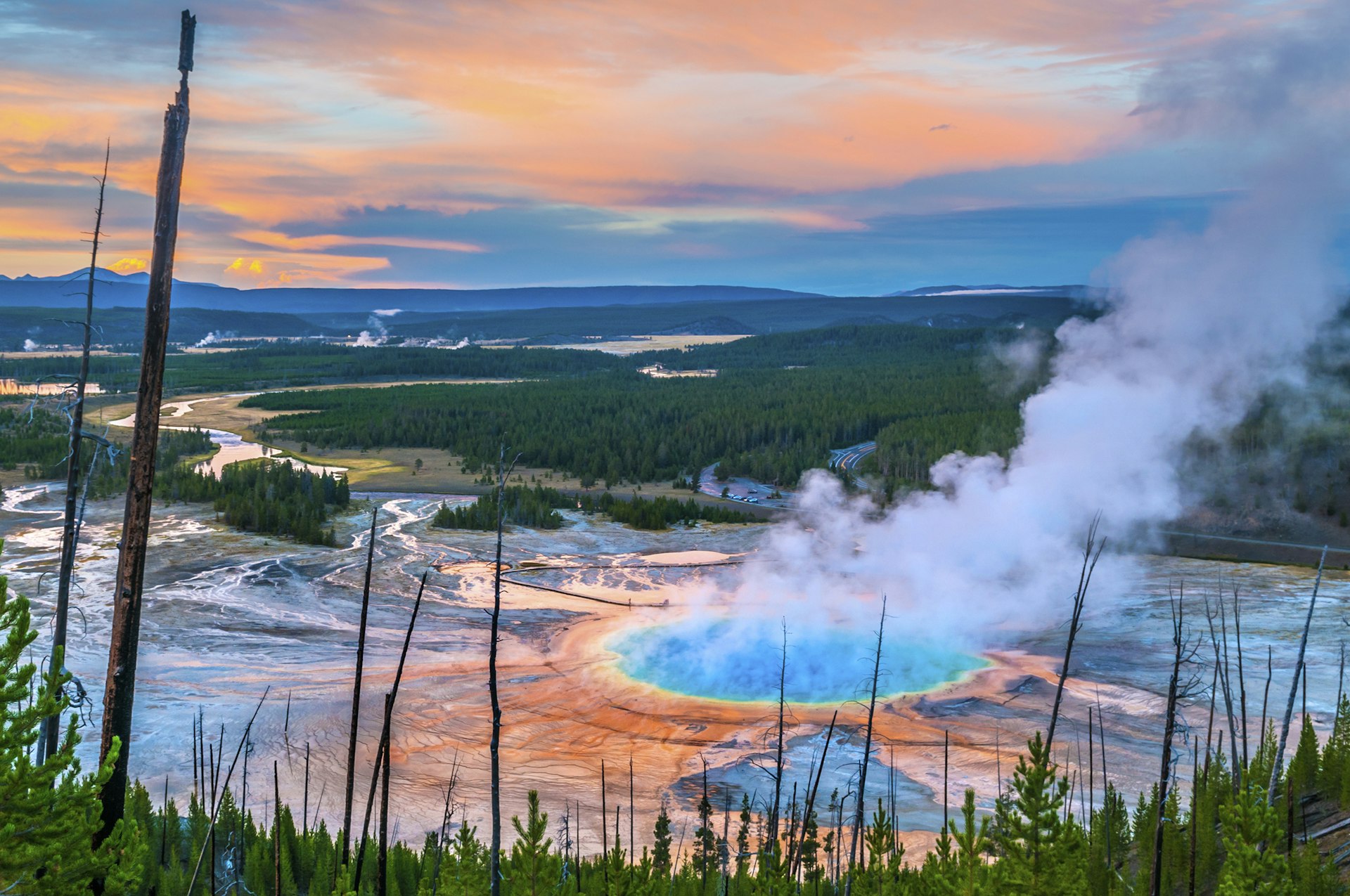 An aerial view of steam rising from the Grand Prismatic Geyser in Yellowstone National Park