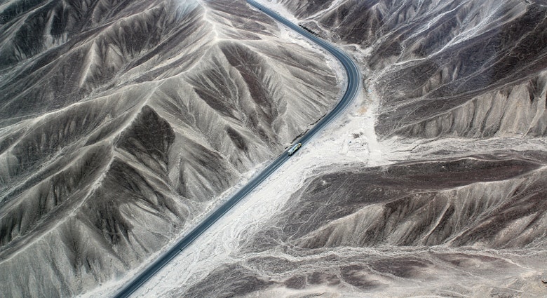 Aerial of the Pan-American highway and the Nazca desert in Peru.