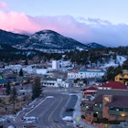 An overlook view of downtown Estes Park, Colorado a sunrise.