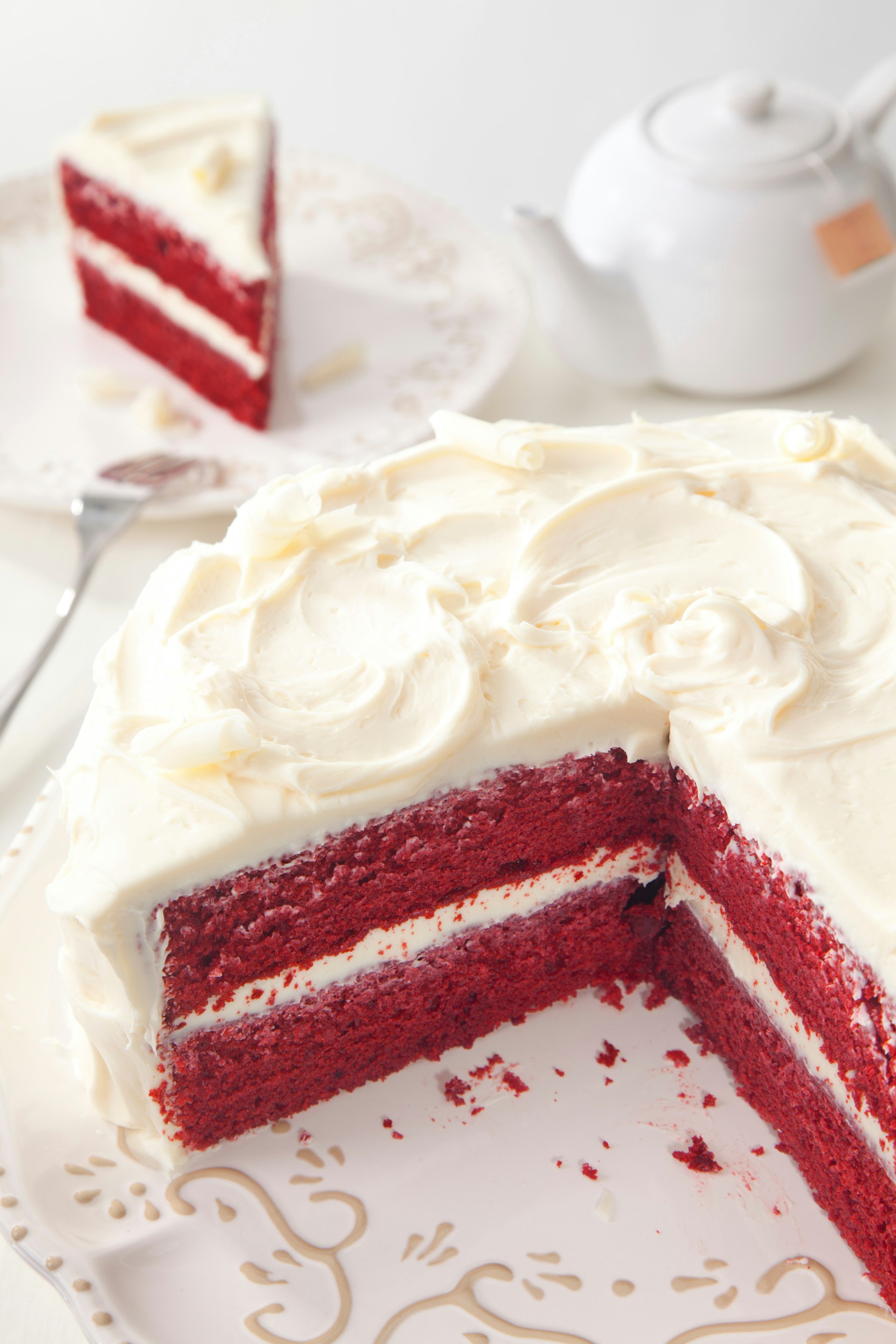 High Angle View Of Red Velvet Cake Slice Served In Plate