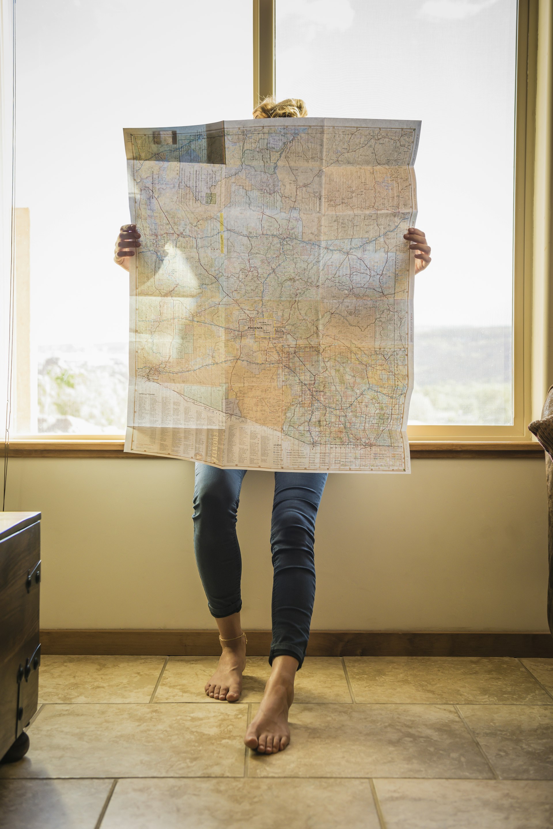 A woman reading a large map