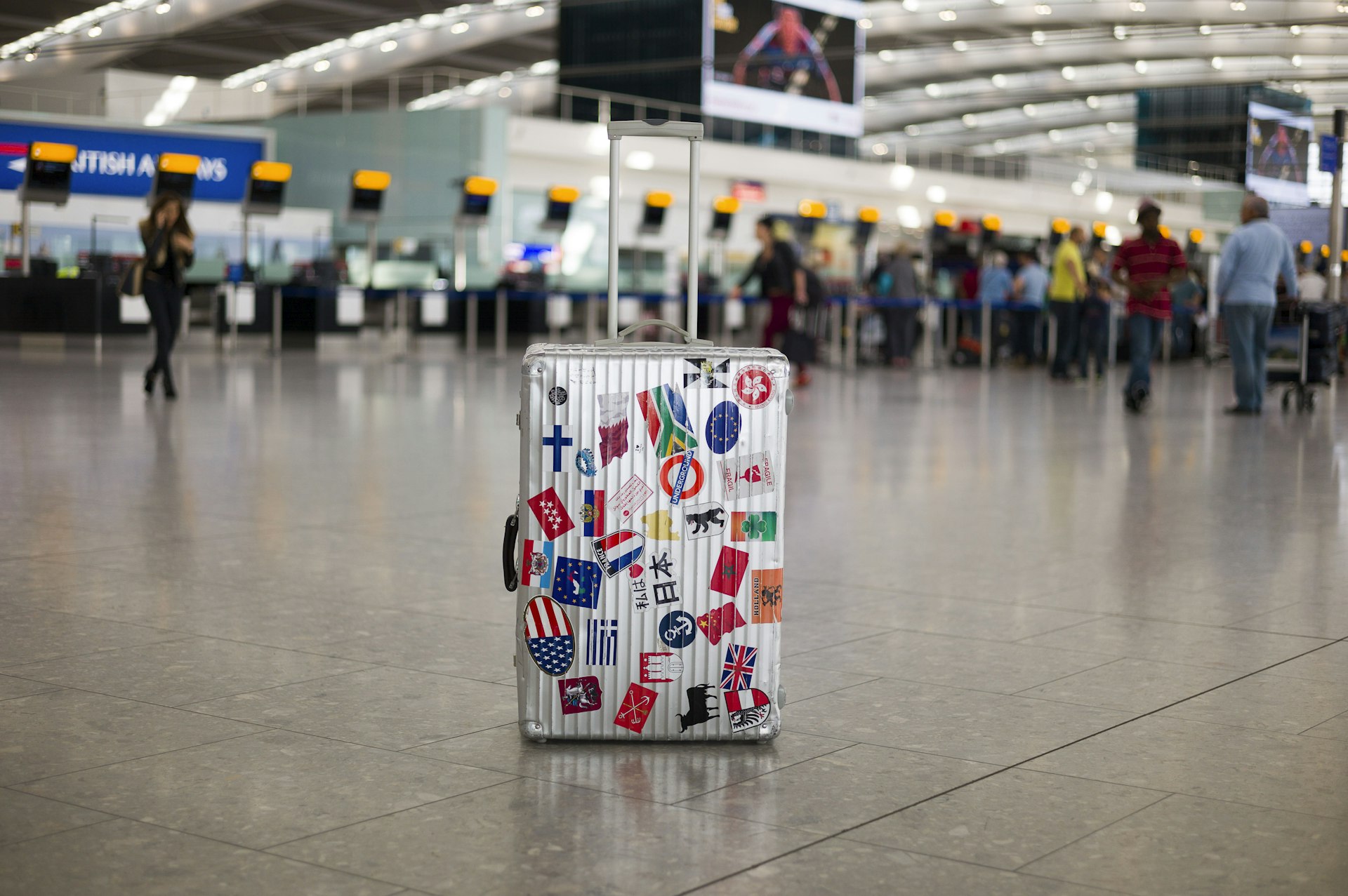 Unattended suitcase in departure zone at airport