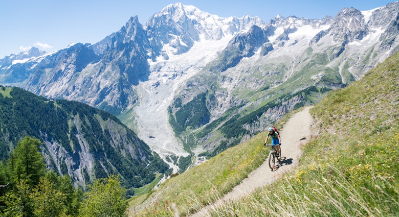 Woman mountain biking in the Aosta Valley.