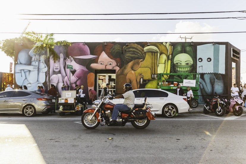 Traffic passes colourful street art in Miami's Wynwood District.
