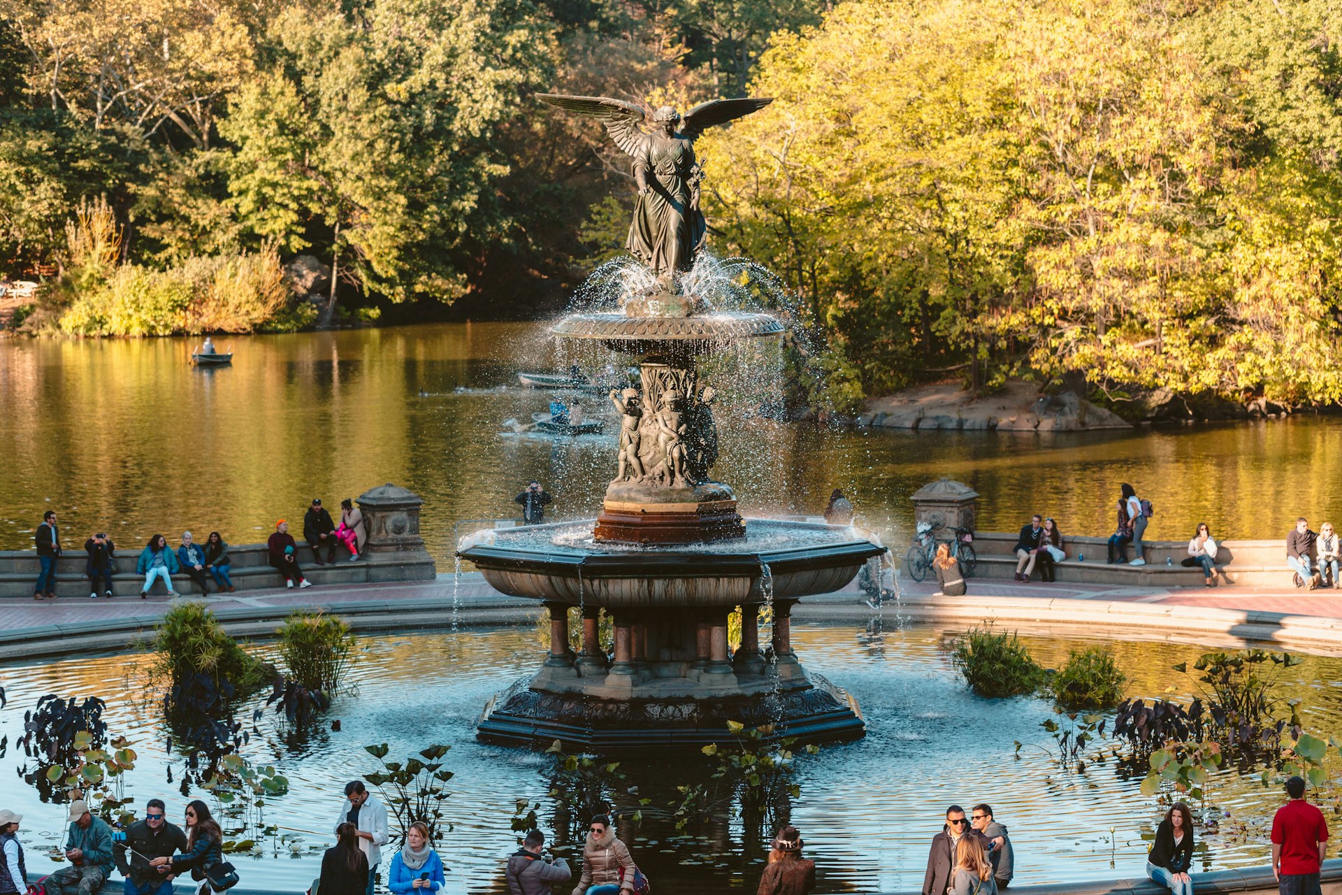 People gather around Bethesda Fountain in Central Park.