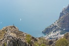 A hiker looking at the Amalfi Coast and the town of Positano.