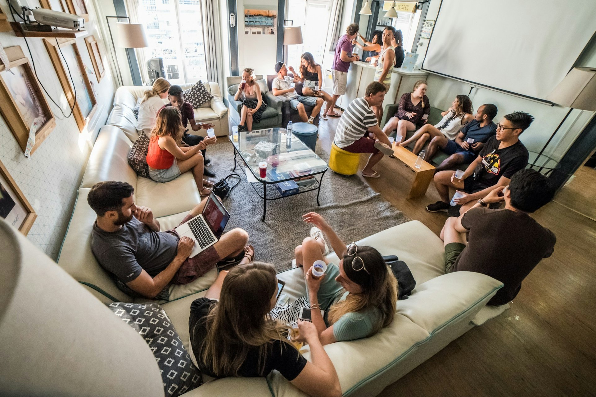 Backpackers in a communal lounge at a hostel