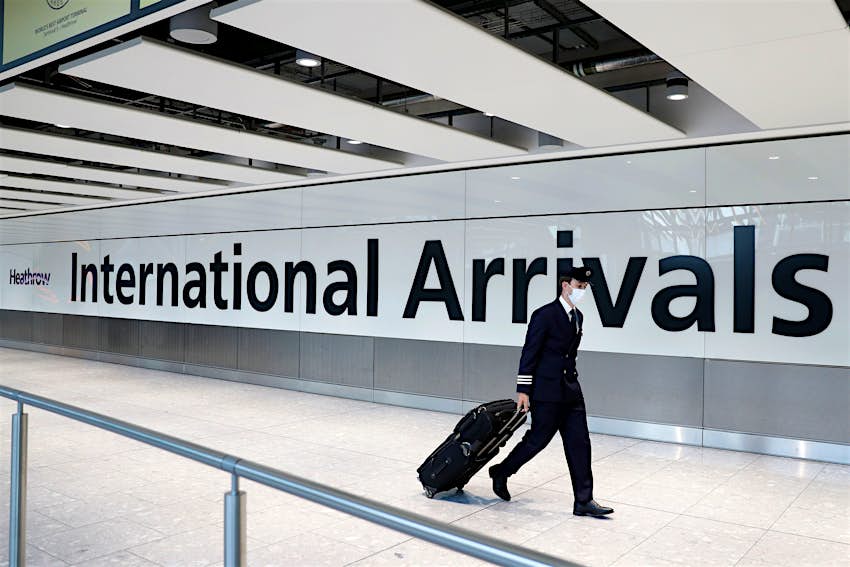 A pilot arrives at London's Heathrow airport