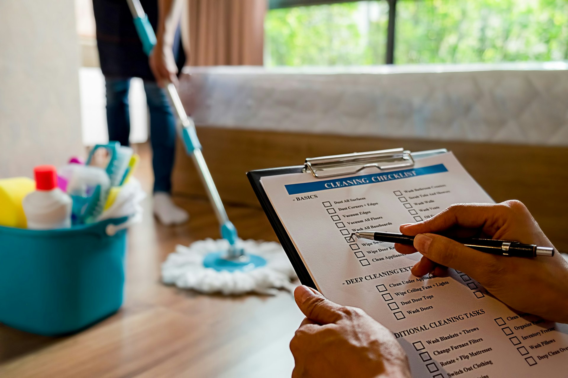 A chambermaid ticking off a checklist of tasks